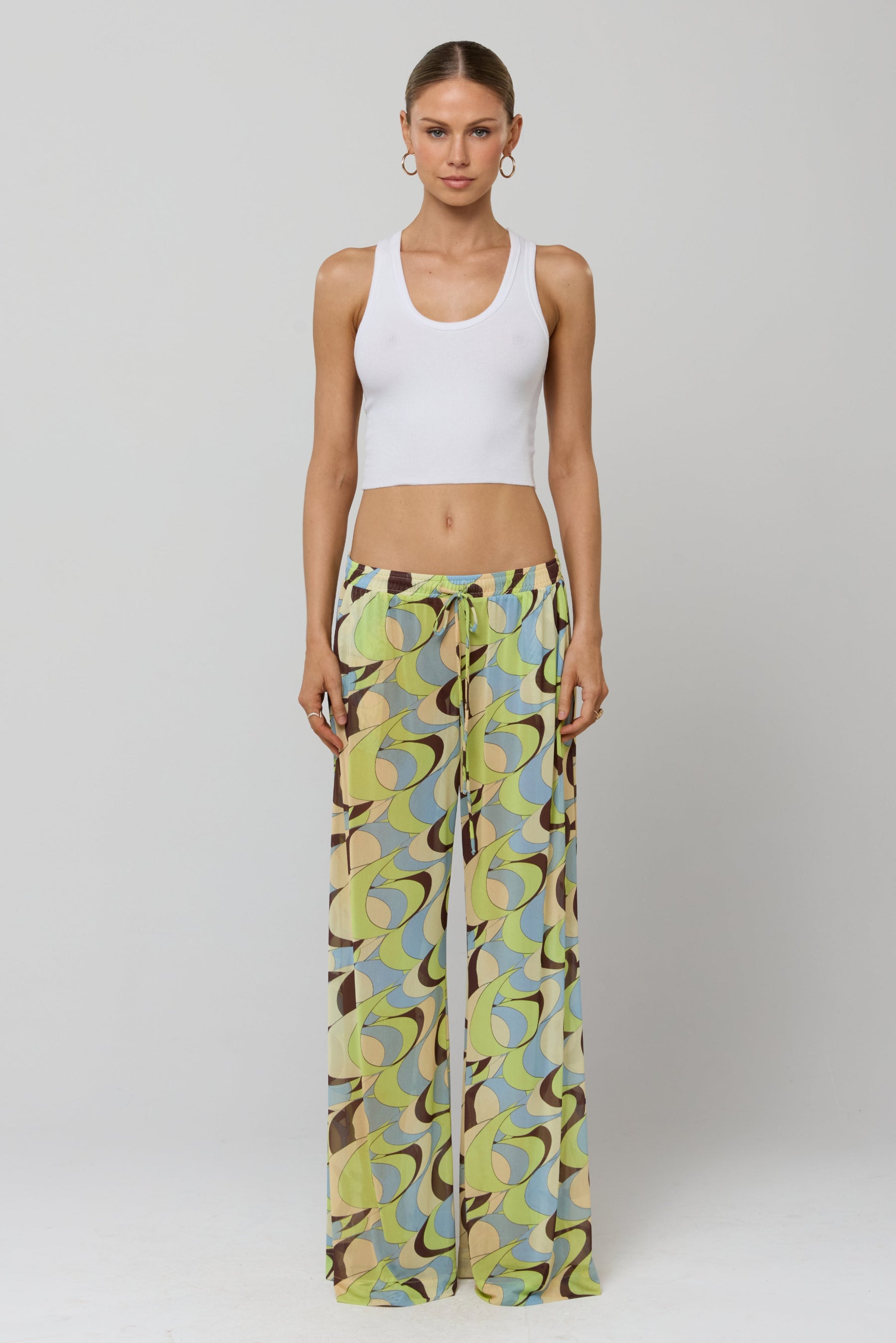 This is an image of Chase Mesh Pant in Palm Royale - RESA featuring a model wearing the dress