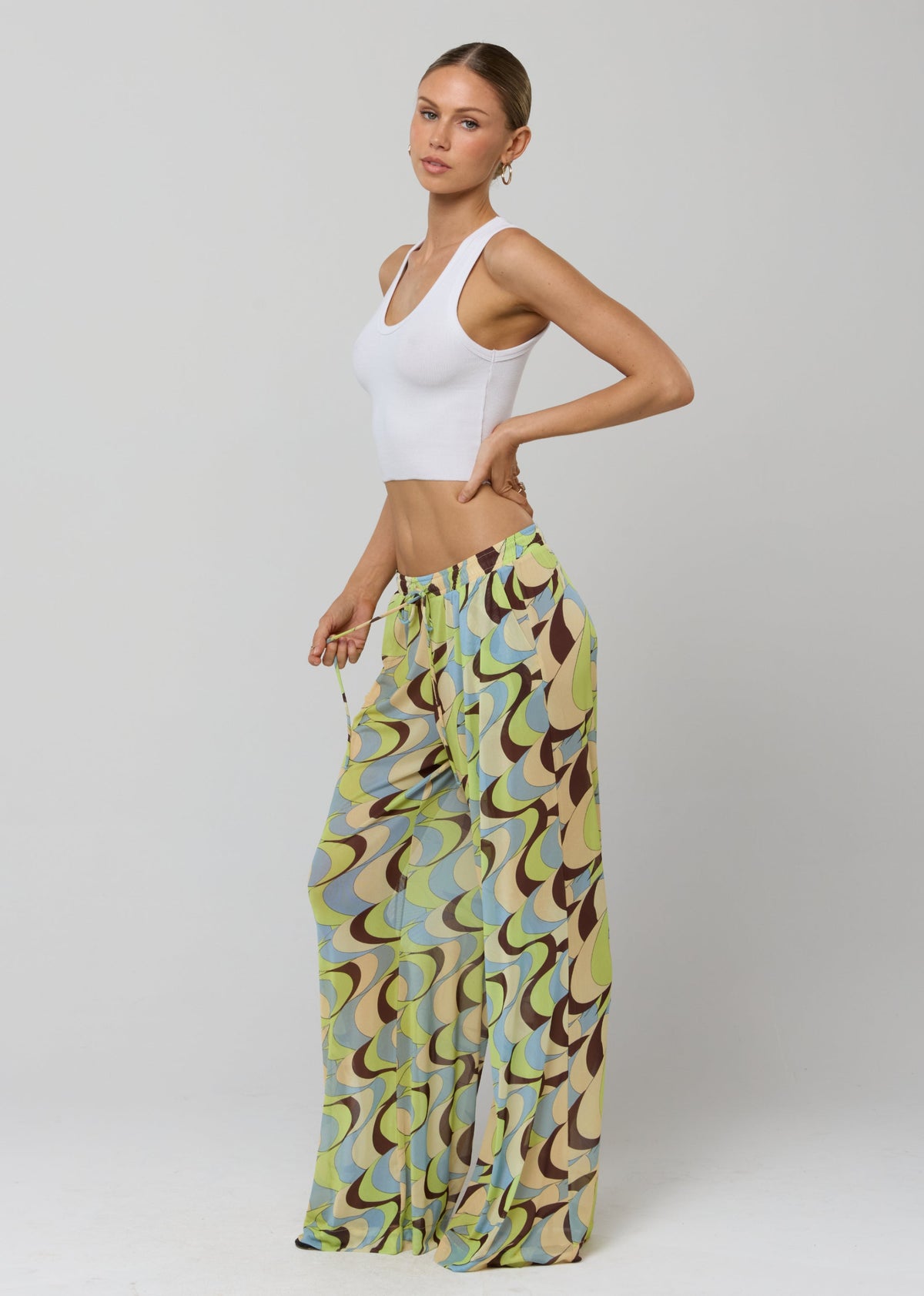 This is an image of Chase Mesh Pant in Palm Royale - RESA featuring a model wearing the dress