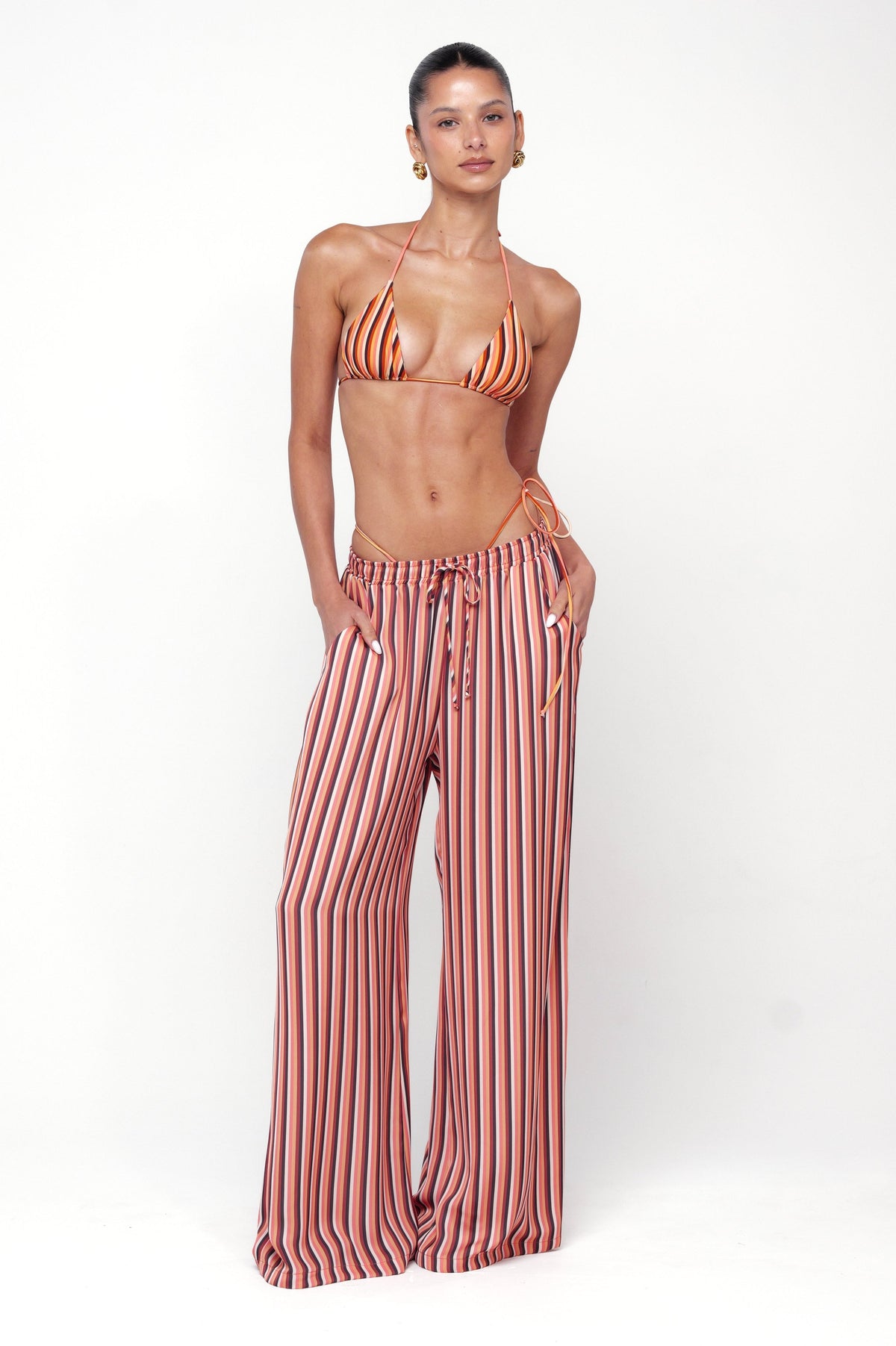 This is an image of Chase Pant in Studio 54 - RESA featuring a model wearing the dress