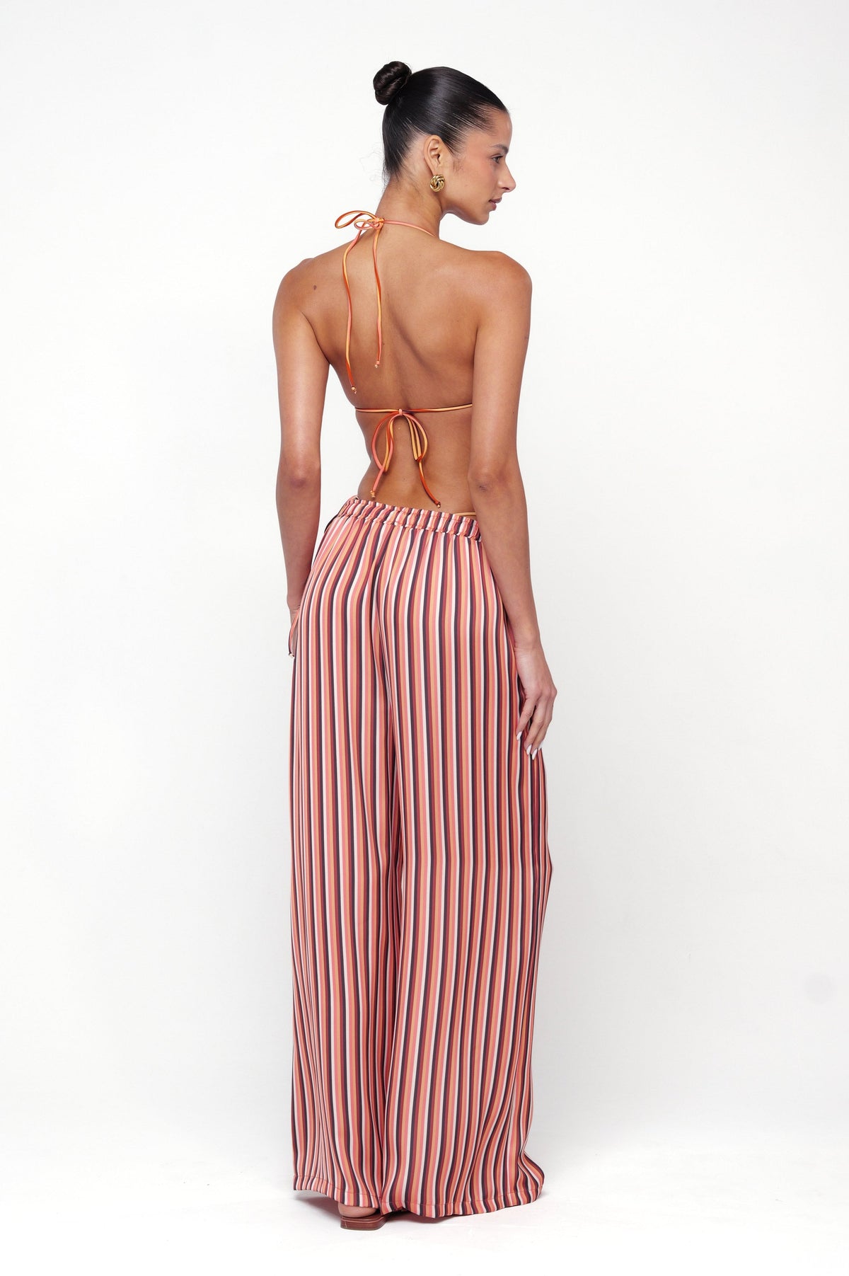 This is an image of Chase Pant in Studio 54 - RESA featuring a model wearing the dress