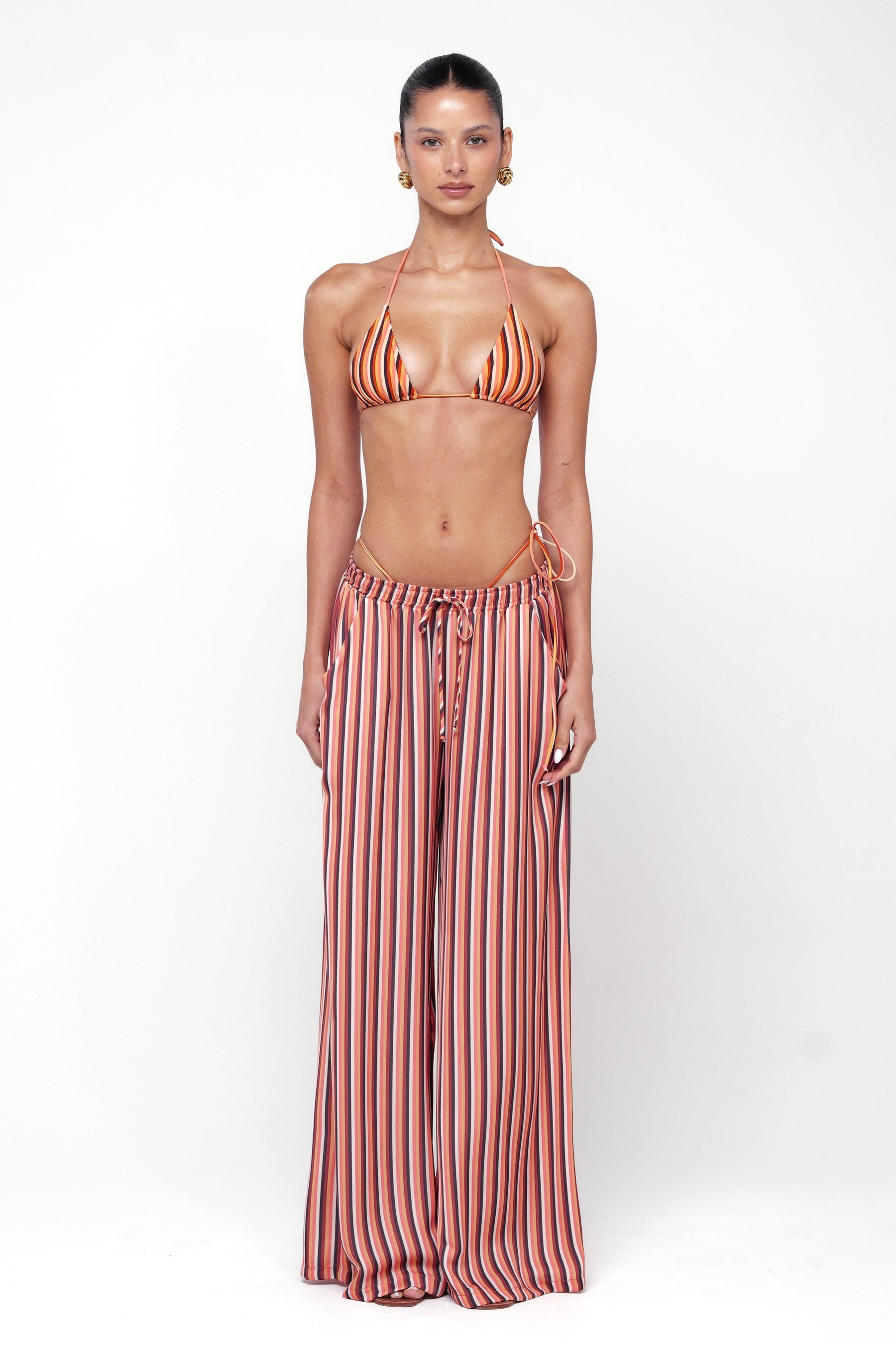 This is an image of Chase Pant in Studio 54 - RESA featuring a model wearing the dress