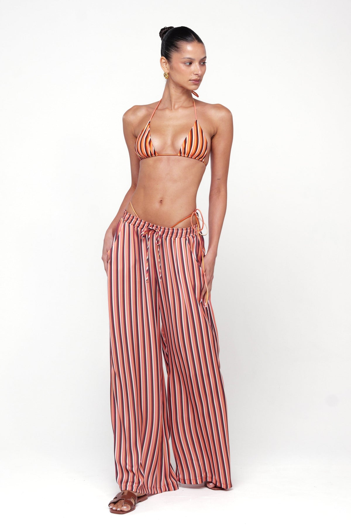 This is an image of Chase Pant in Studio 54 - RESA featuring a model wearing the dress