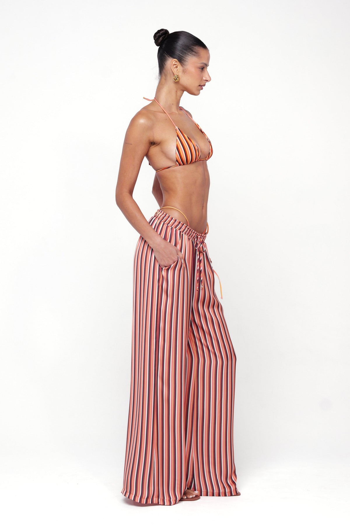 This is an image of Chase Pant in Studio 54 - RESA featuring a model wearing the dress