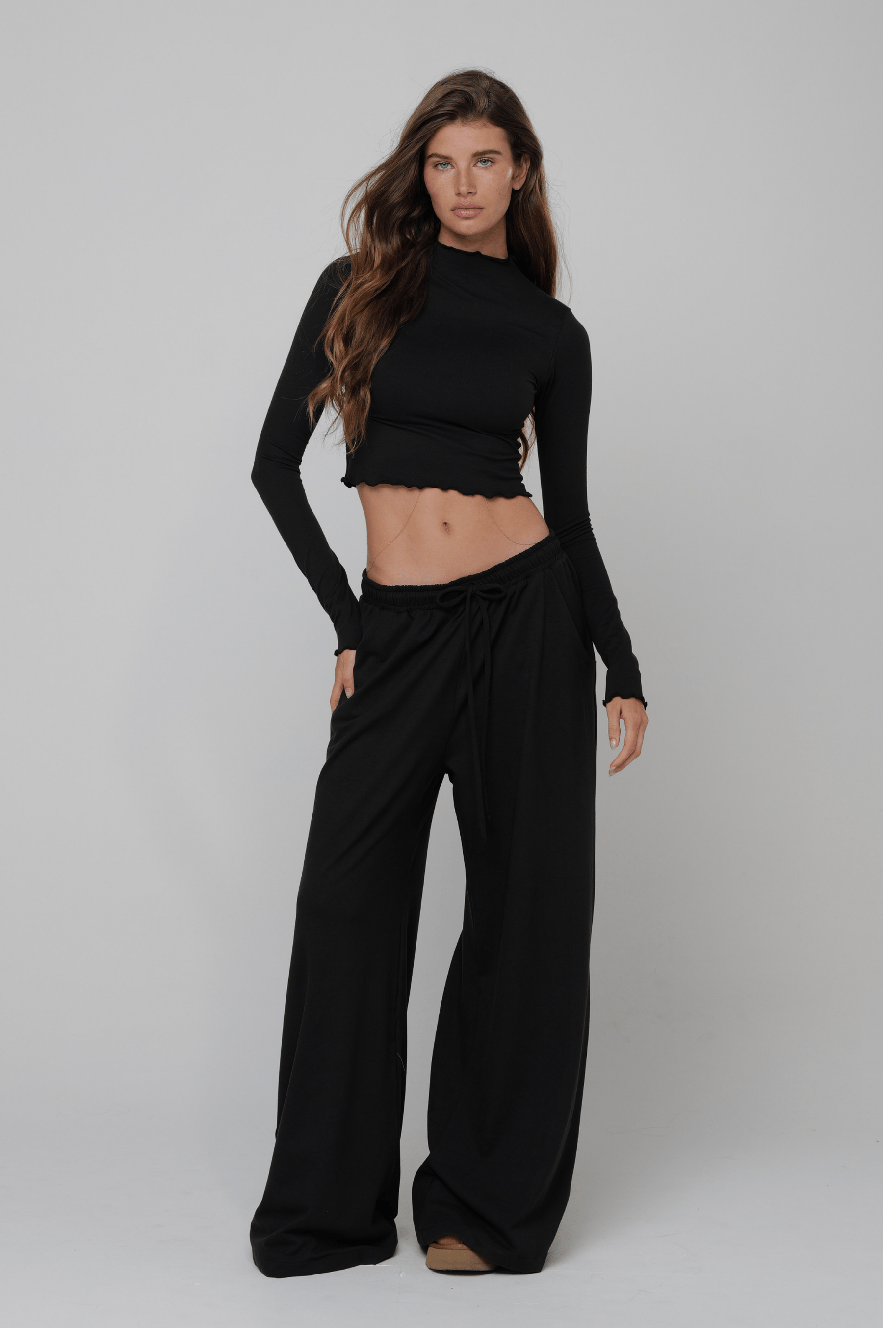 This is an image of Chase Pant Second Skin in Black - RESA featuring a model wearing the dress