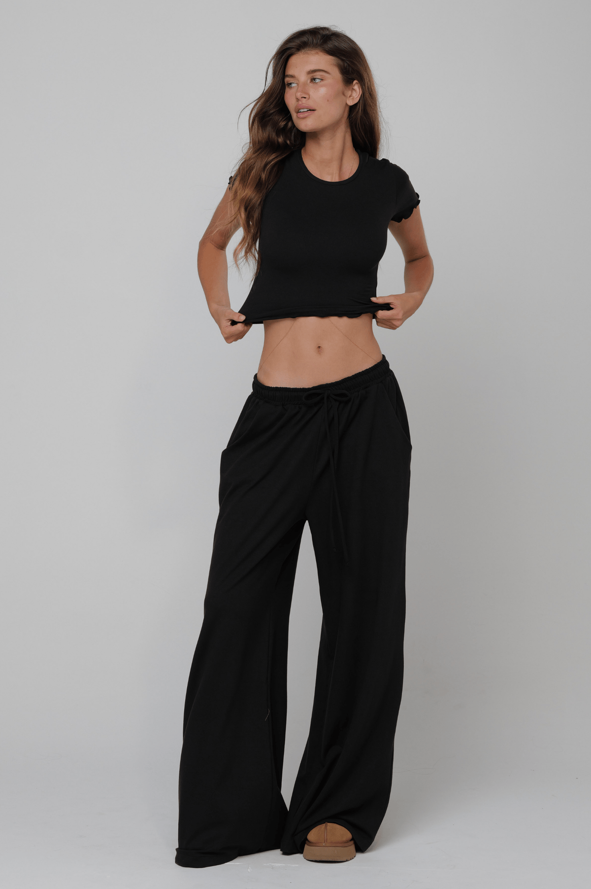 This is an image of Chase Pant Second Skin in Black - RESA featuring a model wearing the dress