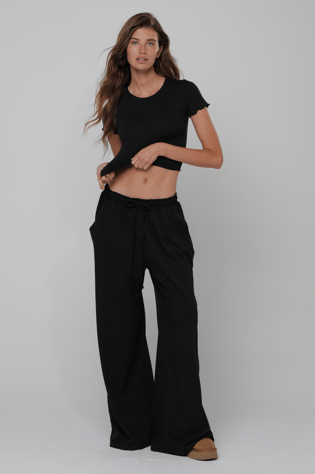 This is an image of Chase Pant Second Skin in Black - RESA featuring a model wearing the dress