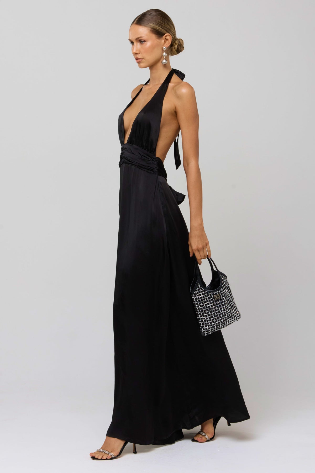 This is an image of Chelsea Dress in Black - RESA featuring a model wearing the dress