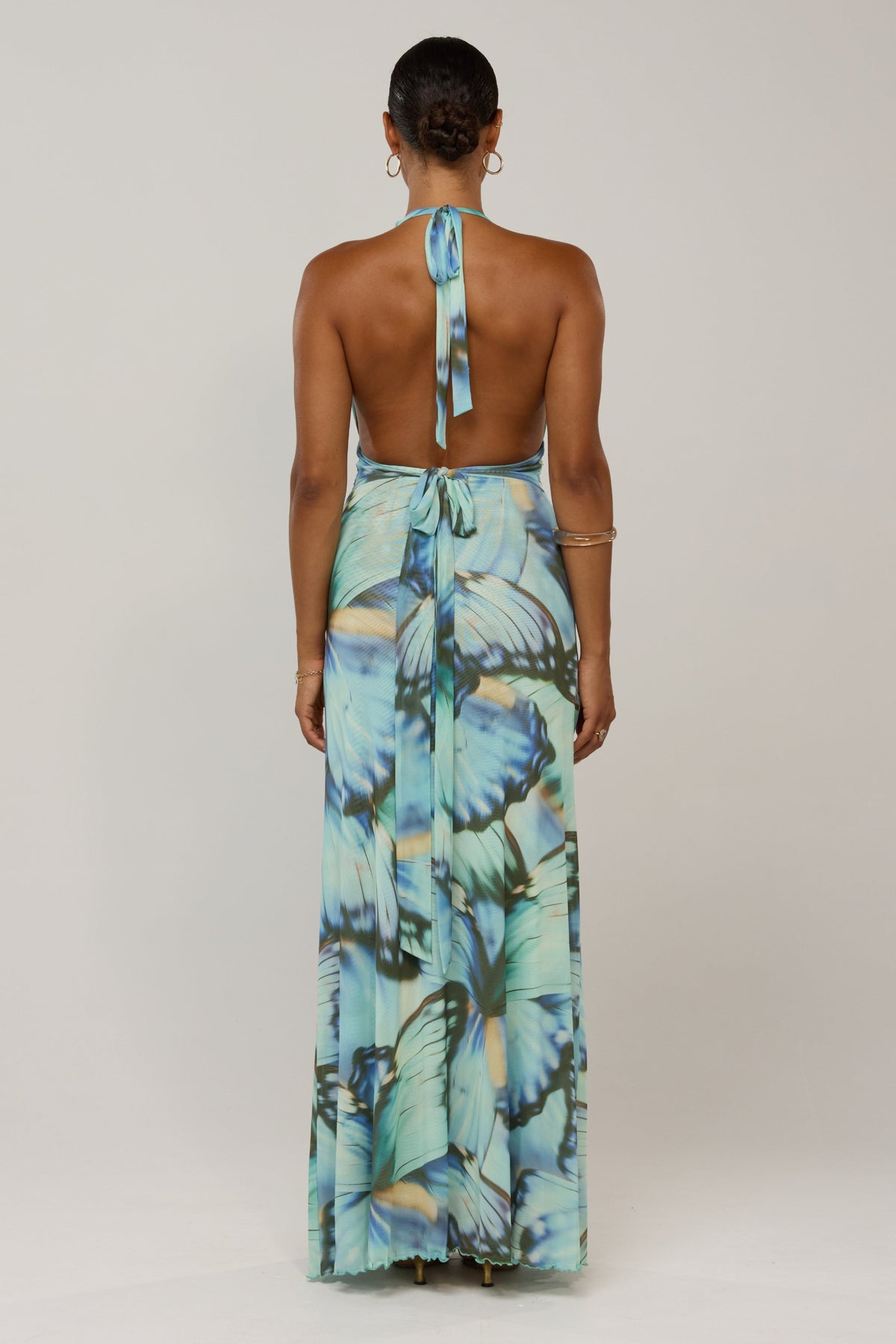 This is an image of Chelsea in Mariposa - RESA featuring a model wearing the dress