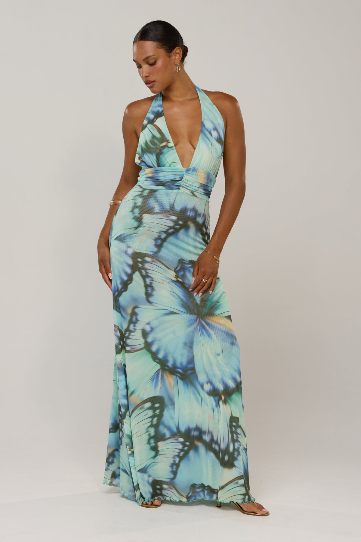 This is an image of Chelsea in Mariposa - RESA featuring a model wearing the dress