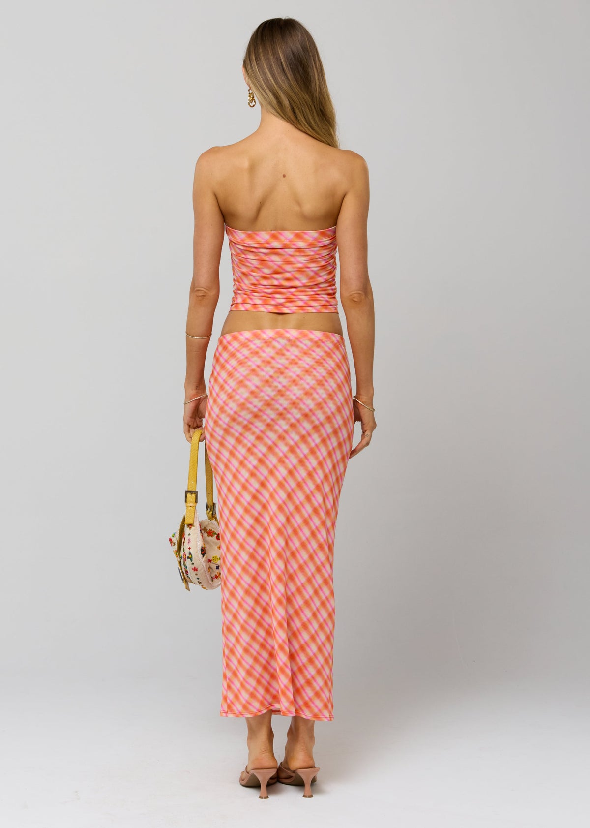 This is an image of Clyde Mesh Skirt in Sorbet - RESA featuring a model wearing the dress