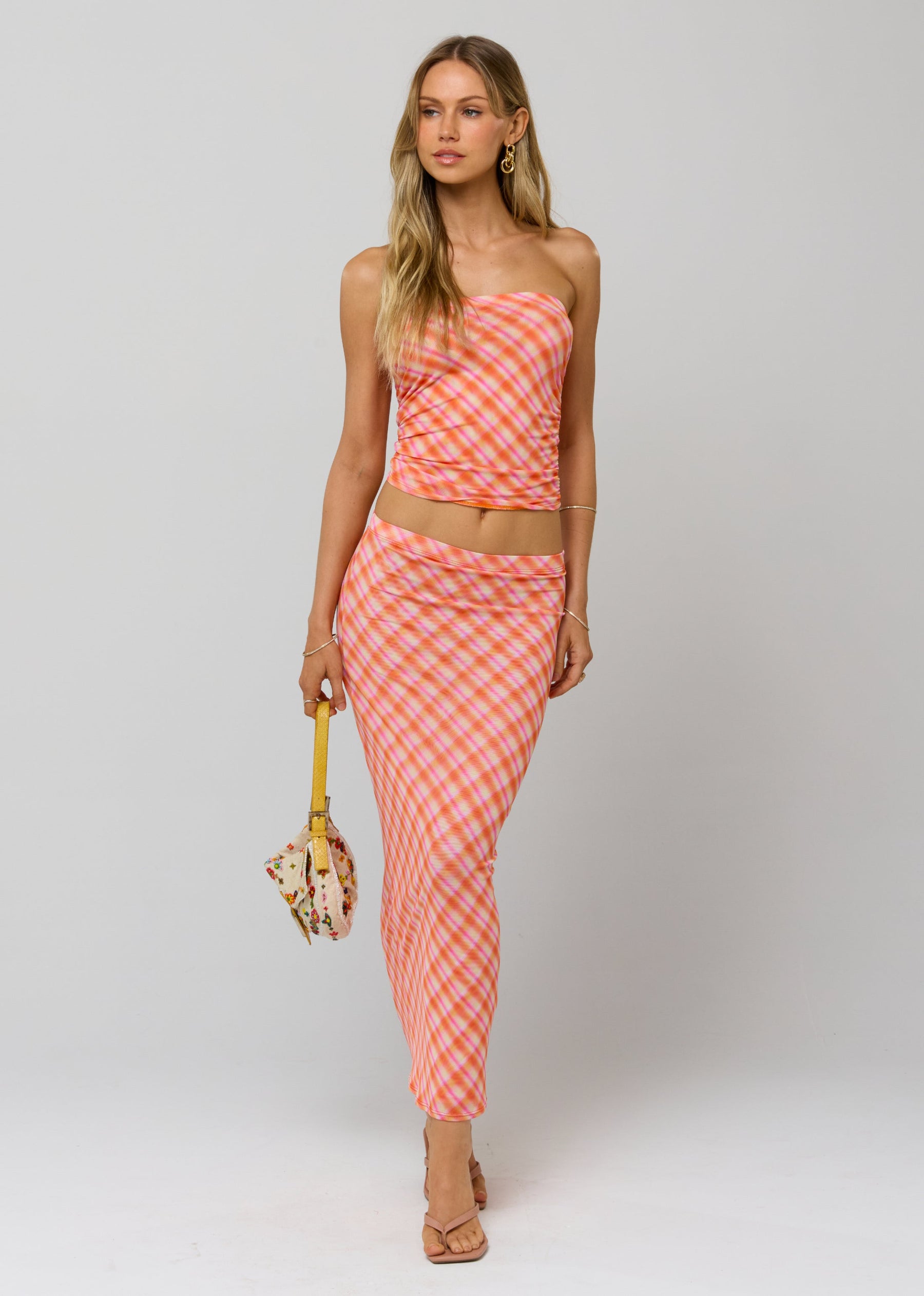 This is an image of Clyde Mesh Skirt in Sorbet - RESA featuring a model wearing the dress