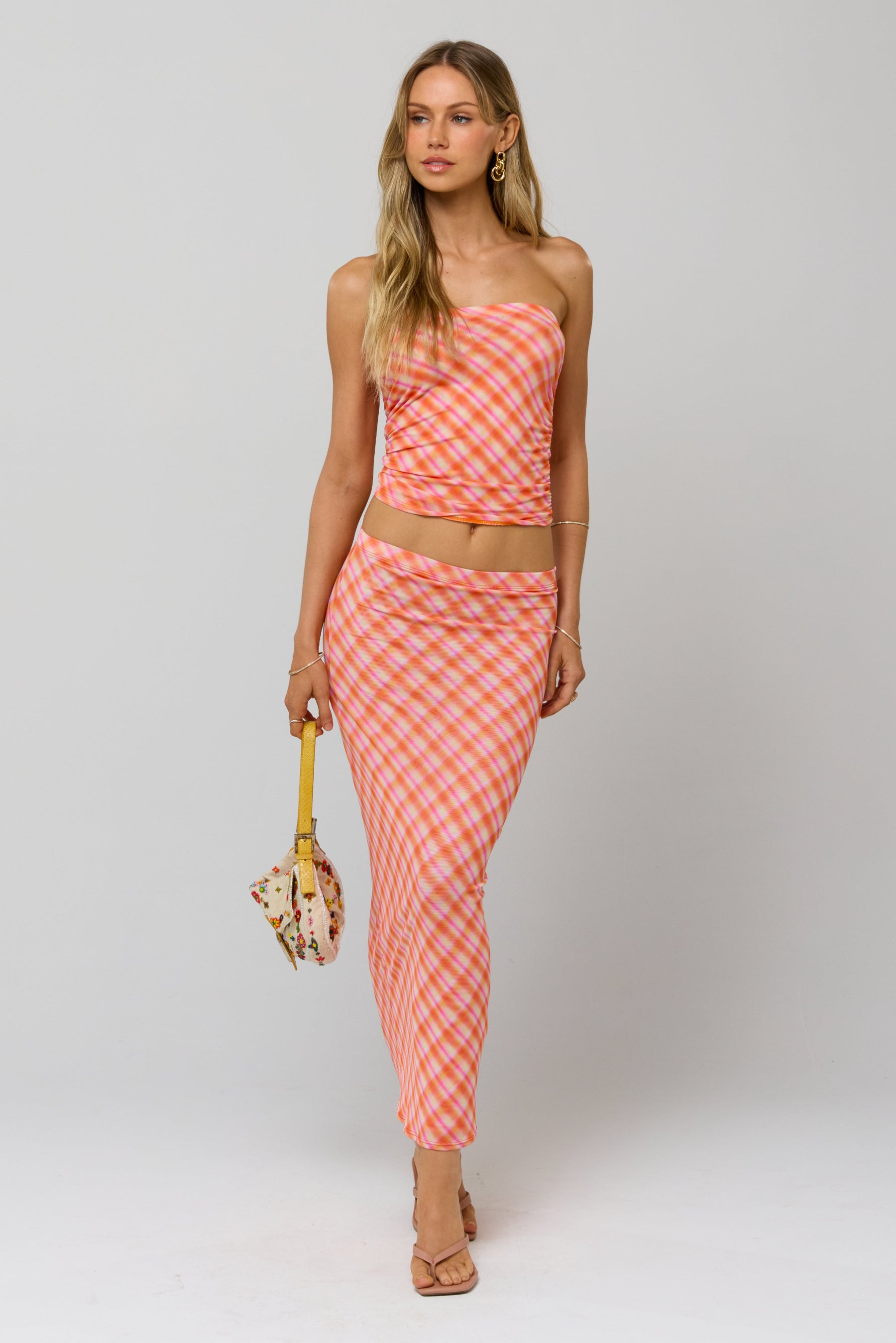 This is an image of Clyde Mesh Skirt in Sorbet - RESA featuring a model wearing the dress