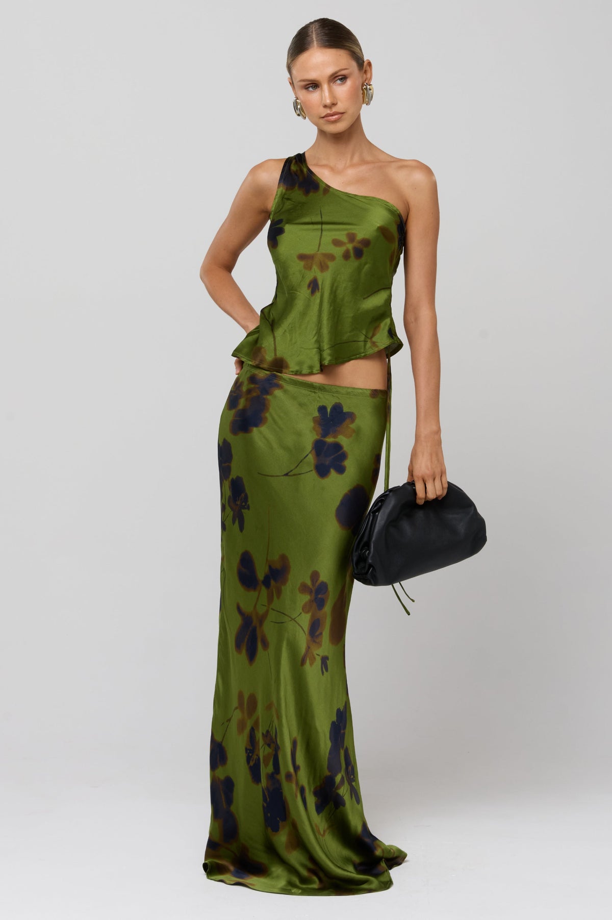 This is an image of Crystal Top in Evergreen - RESA featuring a model wearing the dress