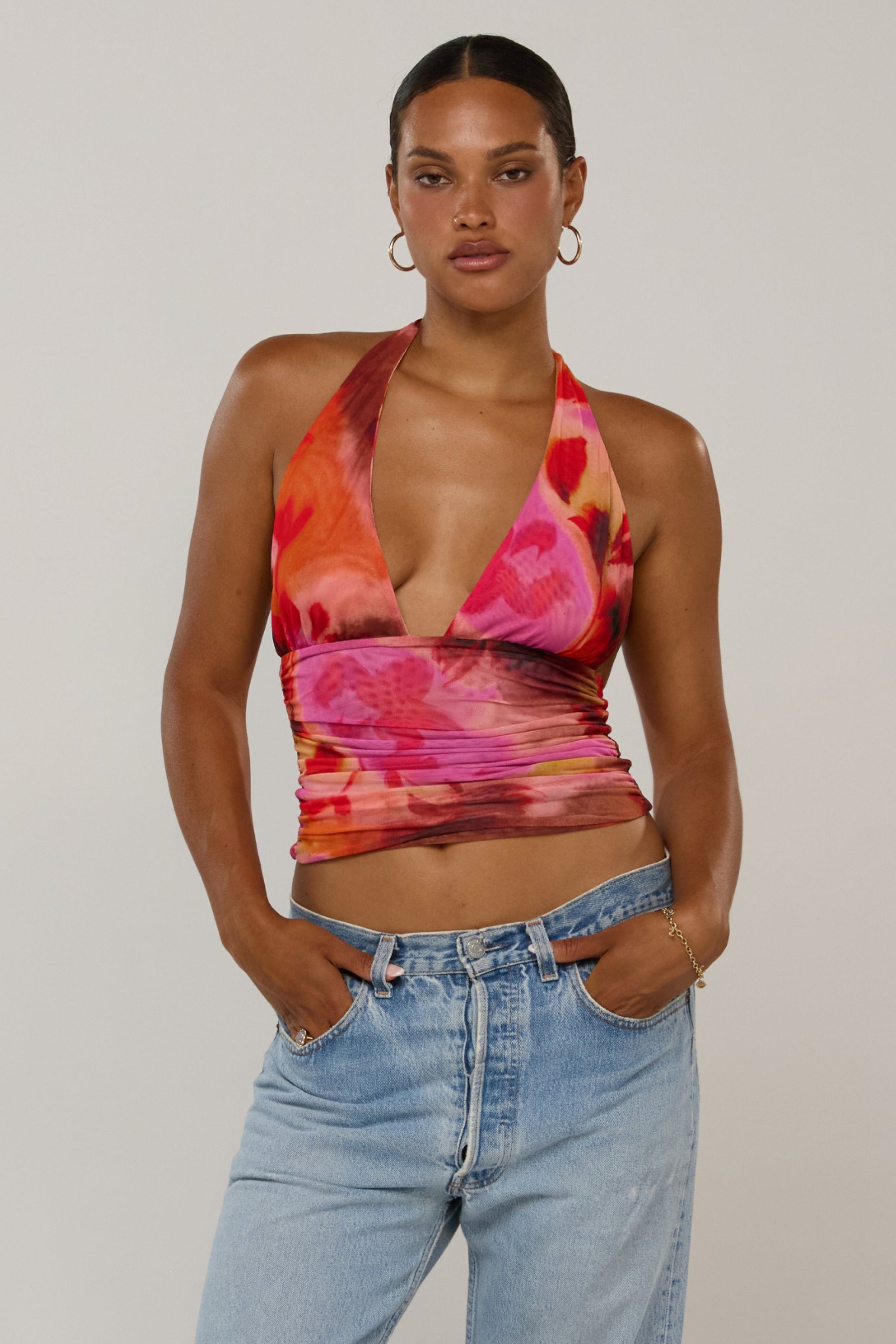 This is an image of Dena in Lilikoi - RESA featuring a model wearing the dress