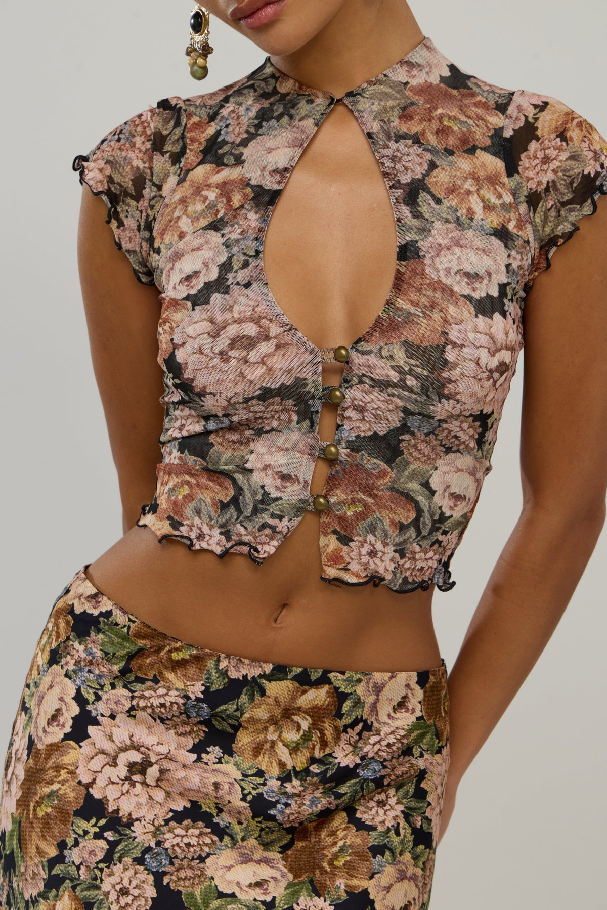 This is an image of Desi in Antique - RESA featuring a model wearing the dress