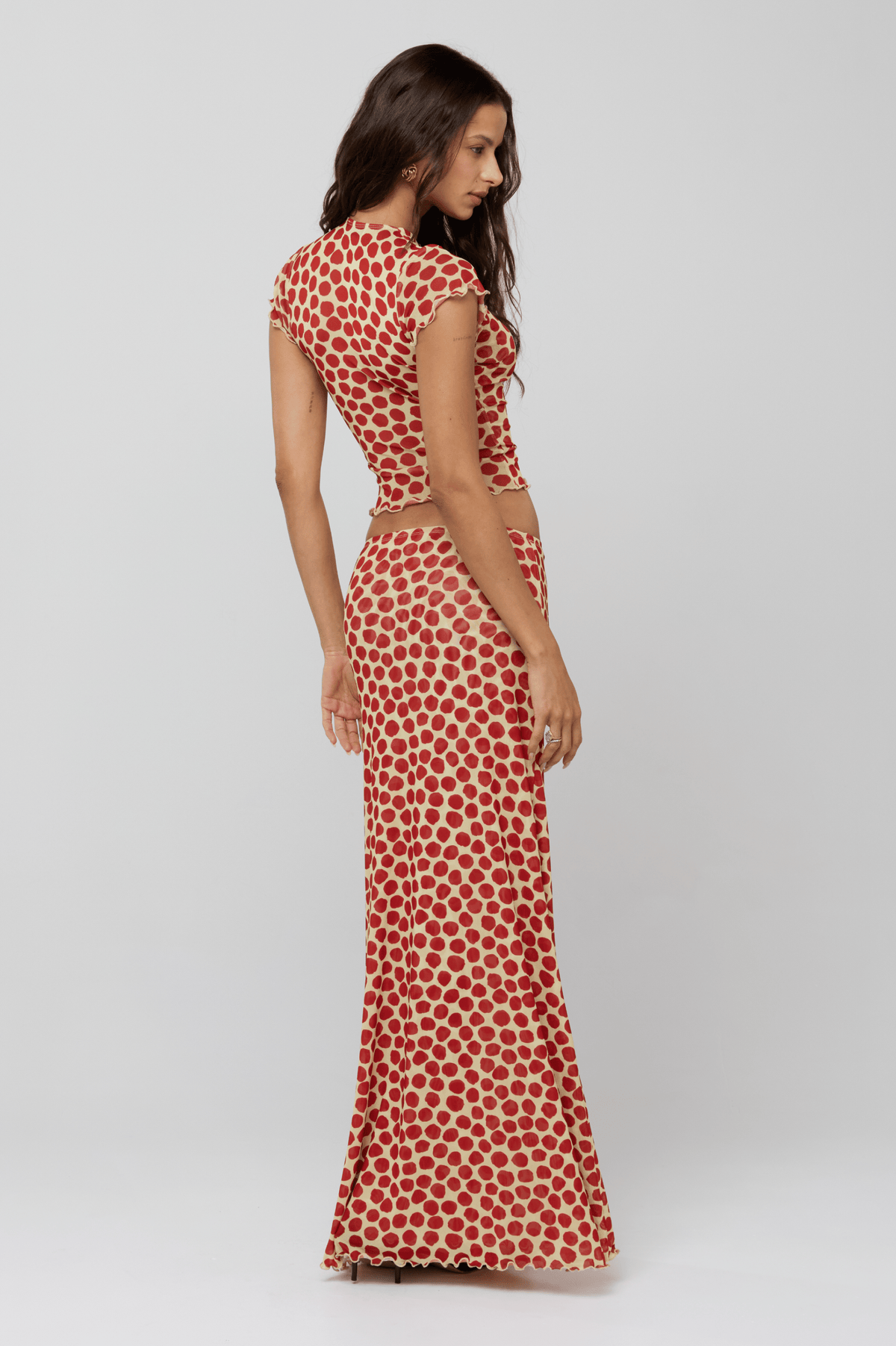 This is an image of Desi Top in Campari - RESA featuring a model wearing the dress