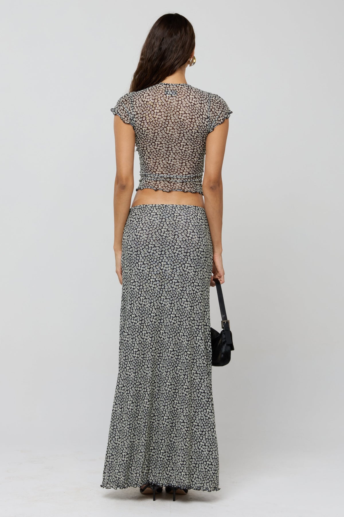 This is an image of Desi Top in Flores - RESA featuring a model wearing the dress