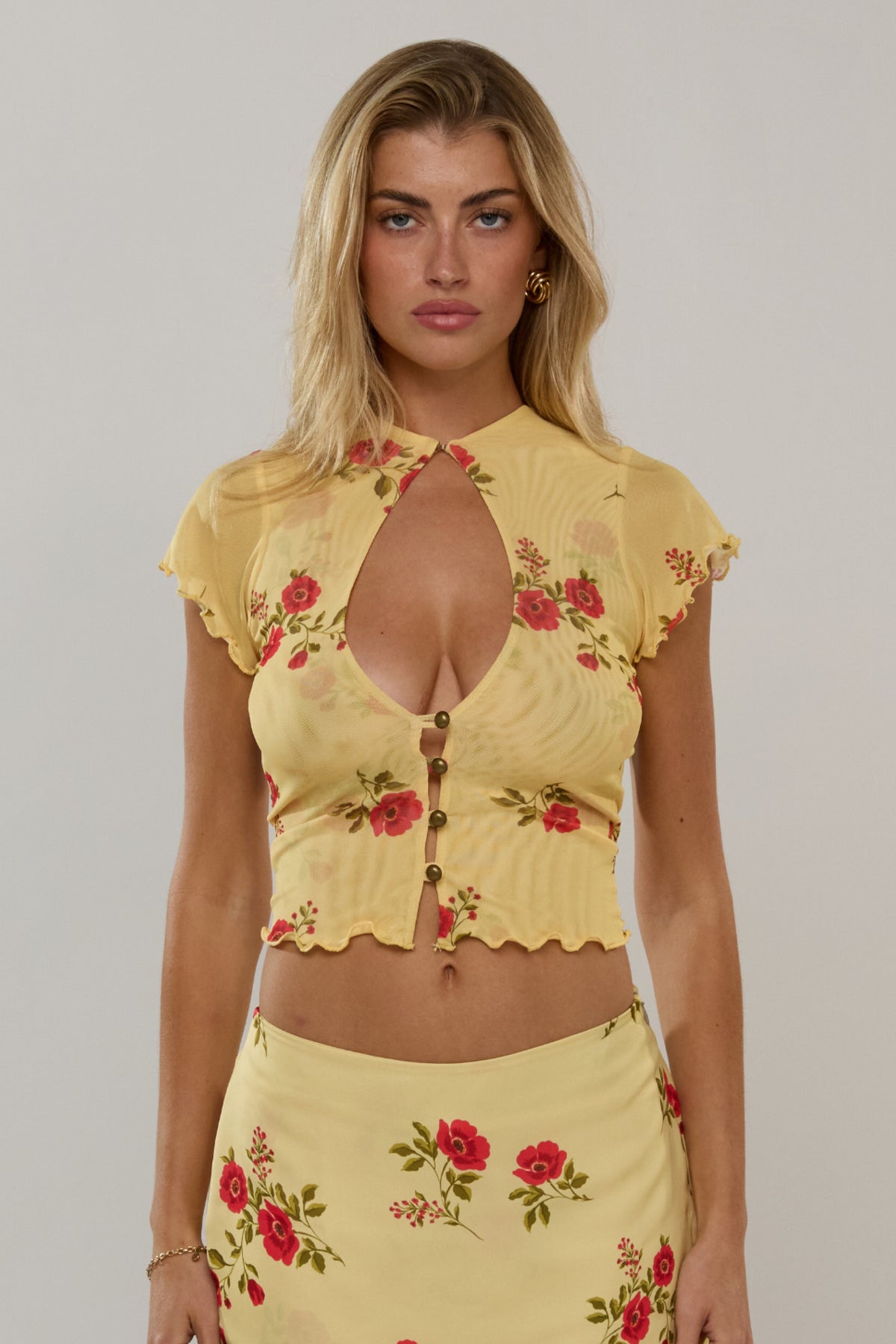 This is an image of Desi Top in Saffron - RESA featuring a model wearing the dress