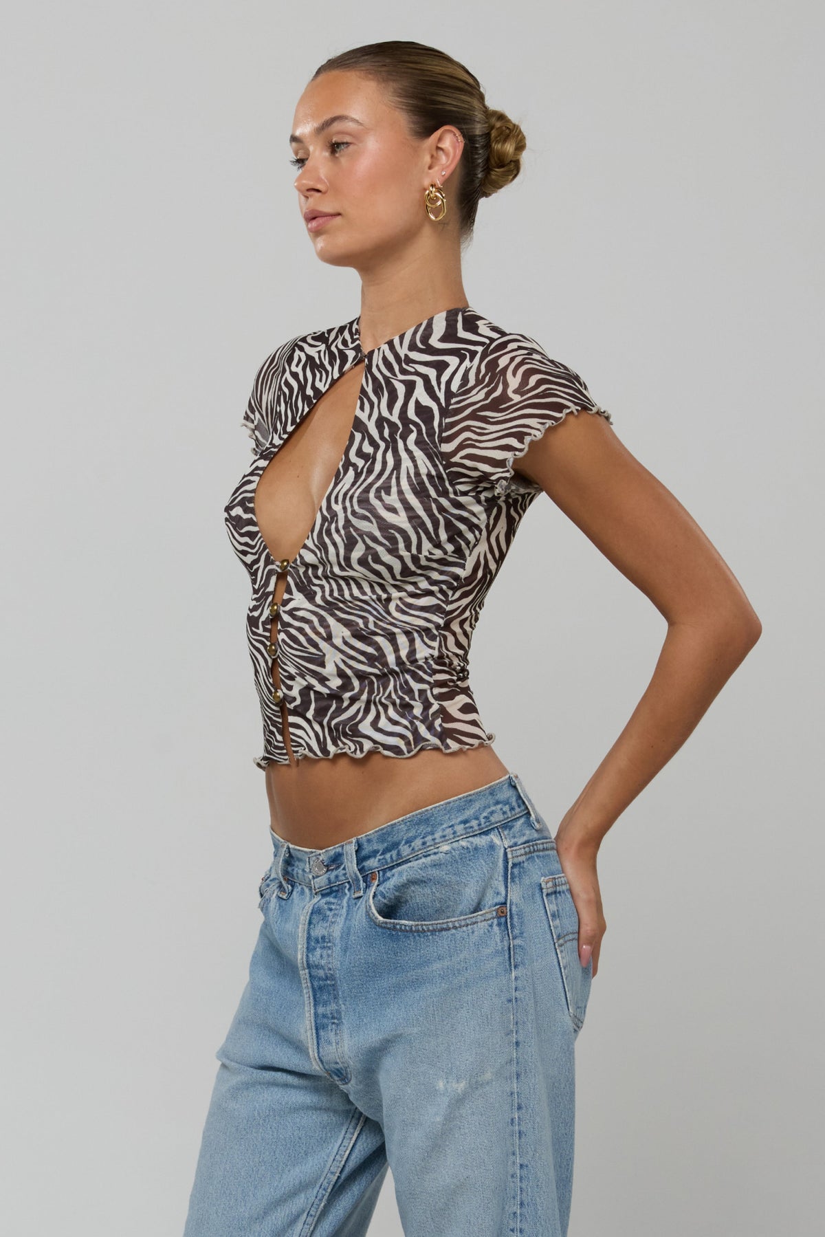 This is an image of Desi Top in Selva - RESA featuring a model wearing the dress