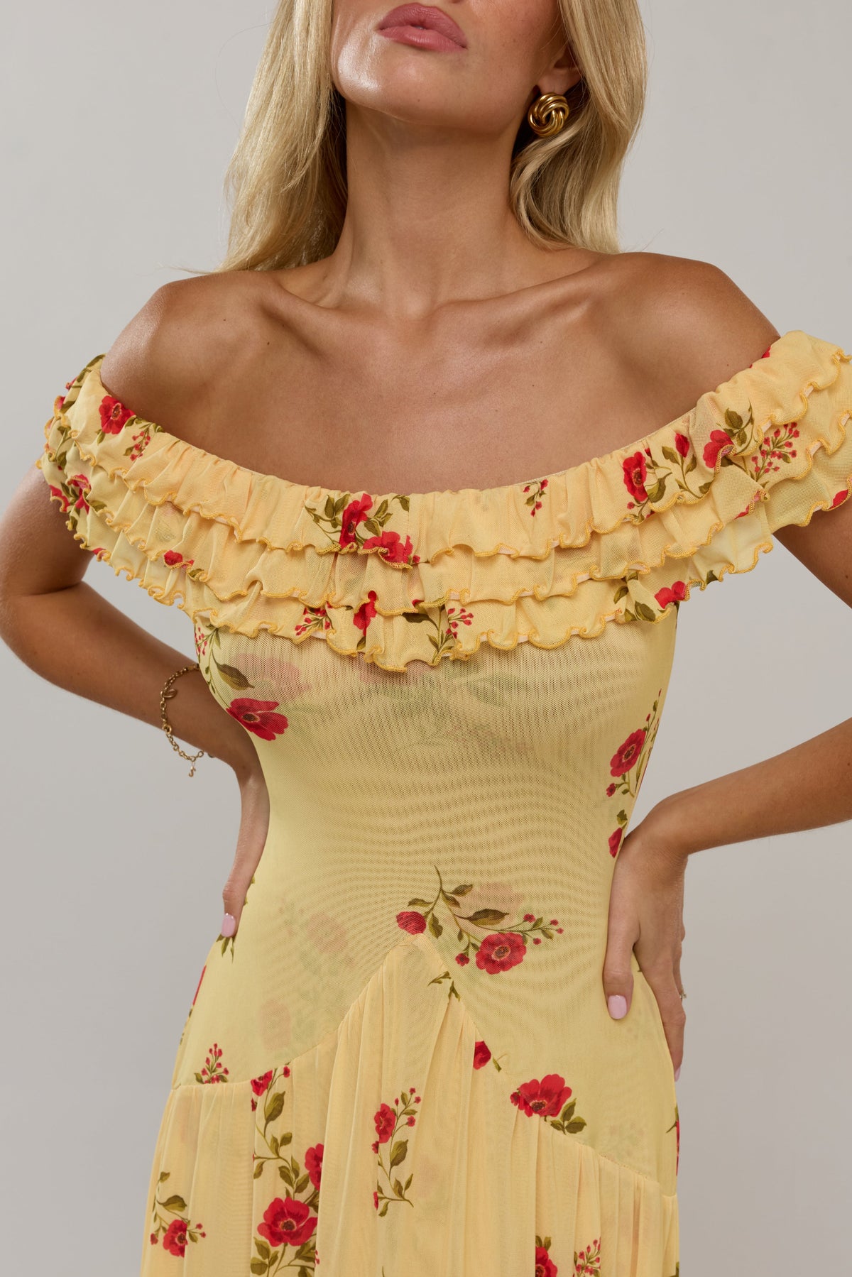 This is an image of Dolly Dress in Saffron - RESA featuring a model wearing the dress