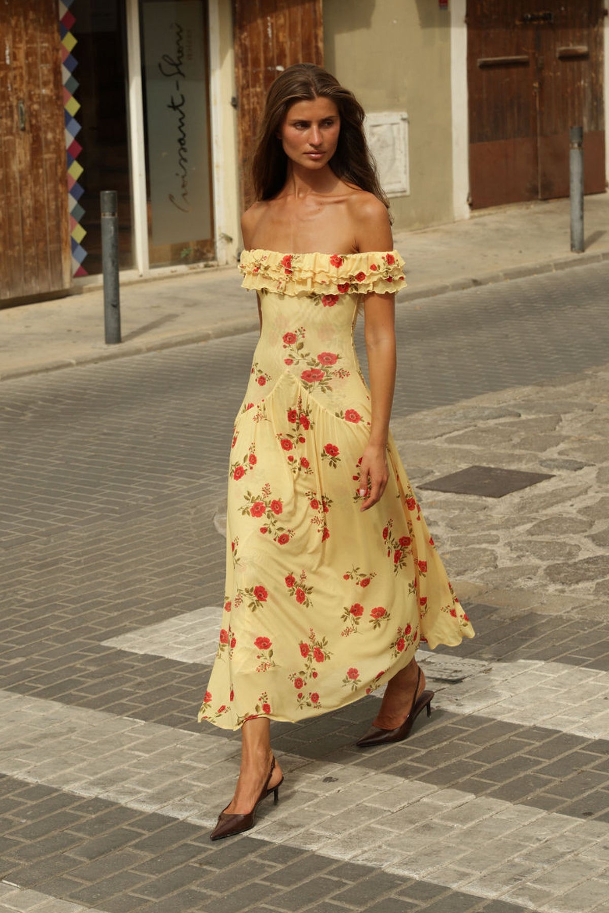 This is an image of Dolly Dress in Saffron - RESA featuring a model wearing the dress