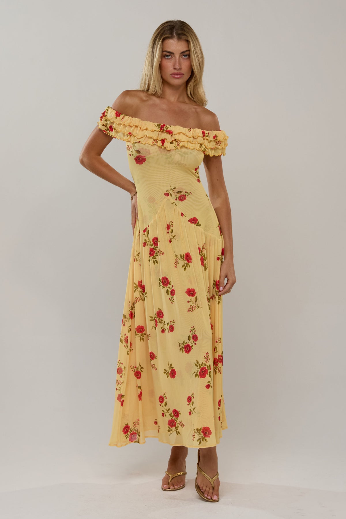 This is an image of Dolly Dress in Saffron - RESA featuring a model wearing the dress