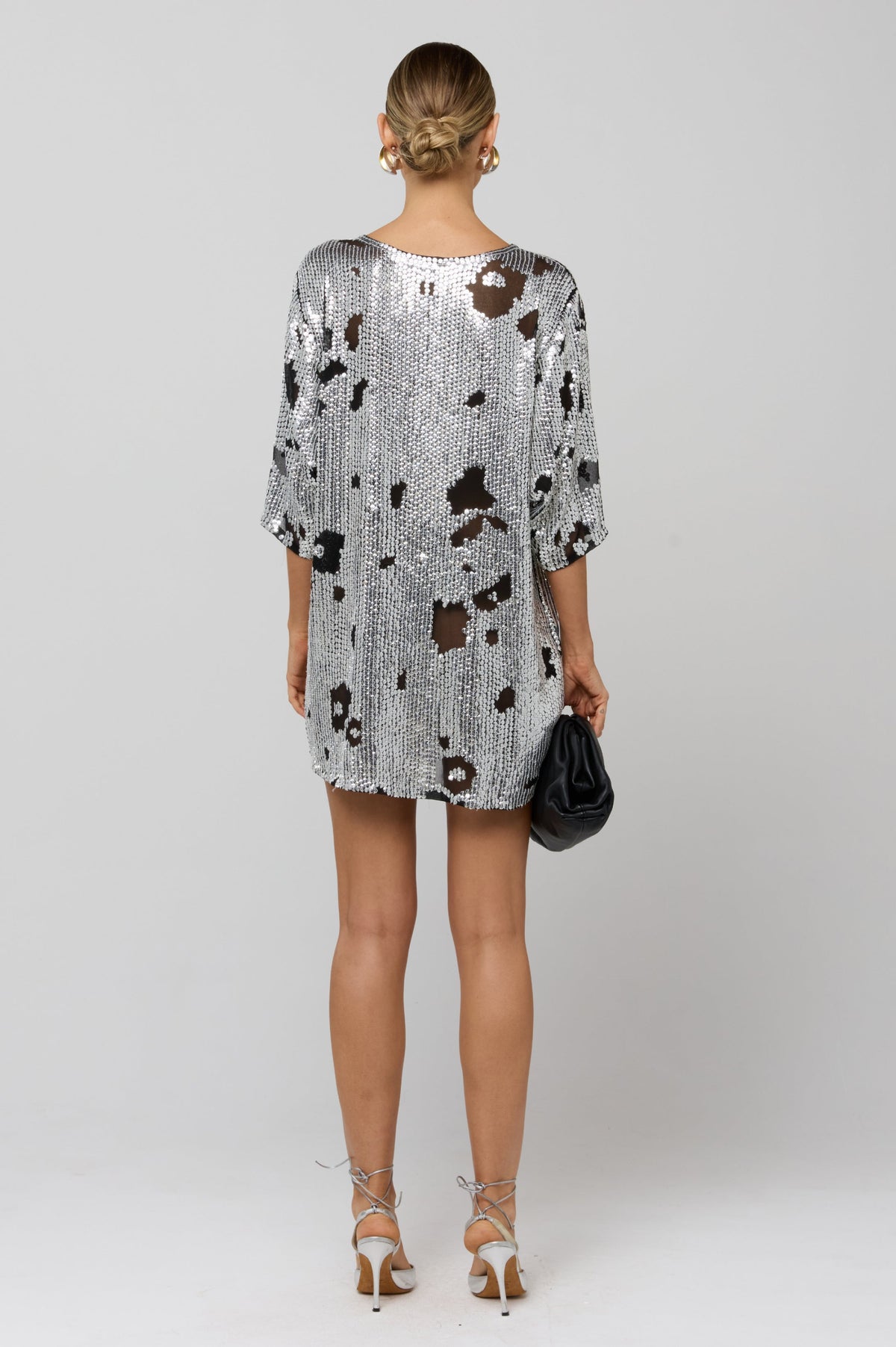 This is an image of Edie Sequin Dress - RESA featuring a model wearing the dress