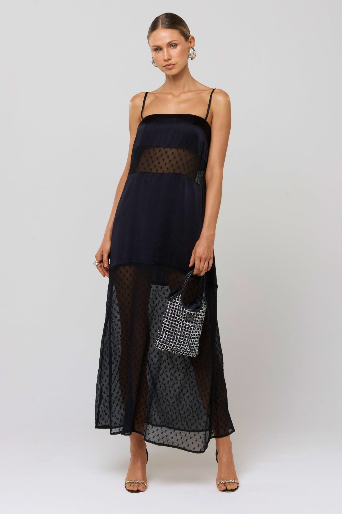 This is an image of Eli Panel Dress Black - RESA featuring a model wearing the dress