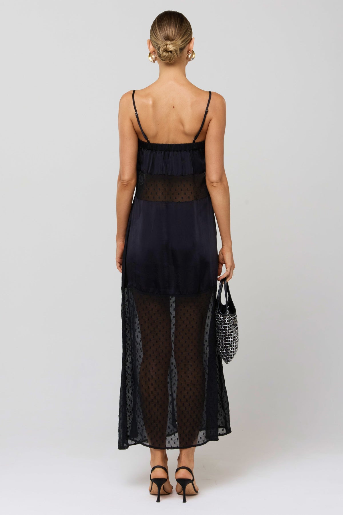 This is an image of Eli Panel Dress Black - RESA featuring a model wearing the dress