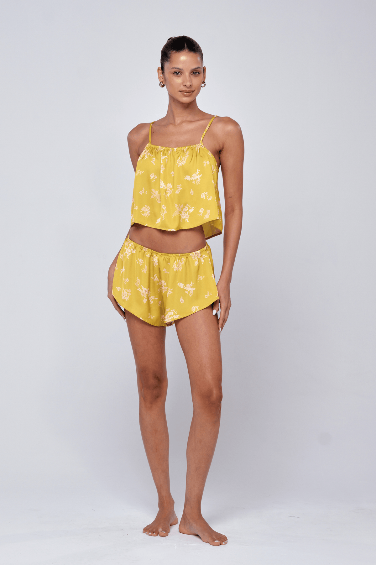 This is an image of Ellie Set in Citrus - RESA featuring a model wearing the dress