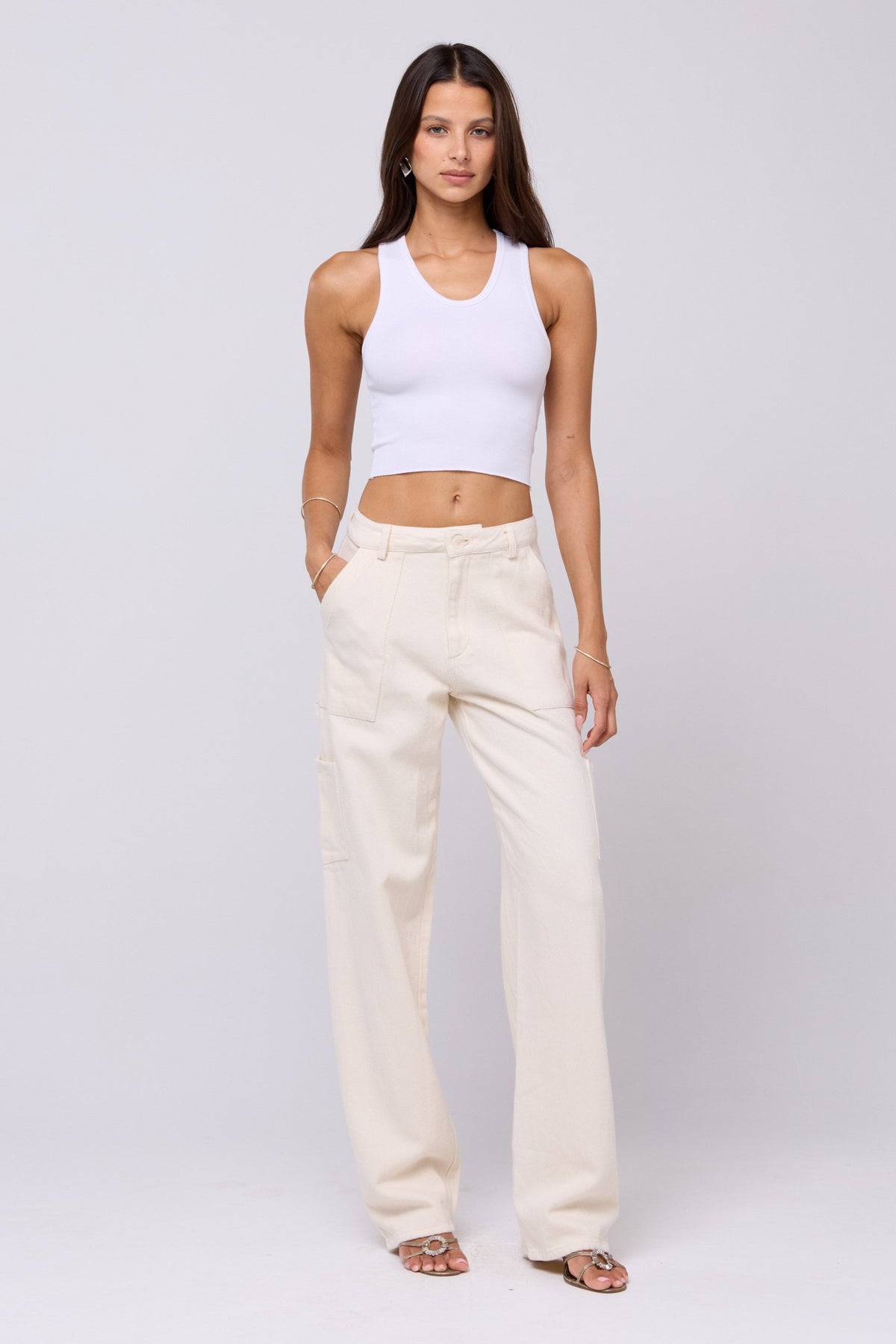 This is an image of Elsa Cargo Pant in Cream - RESA featuring a model wearing the dress
