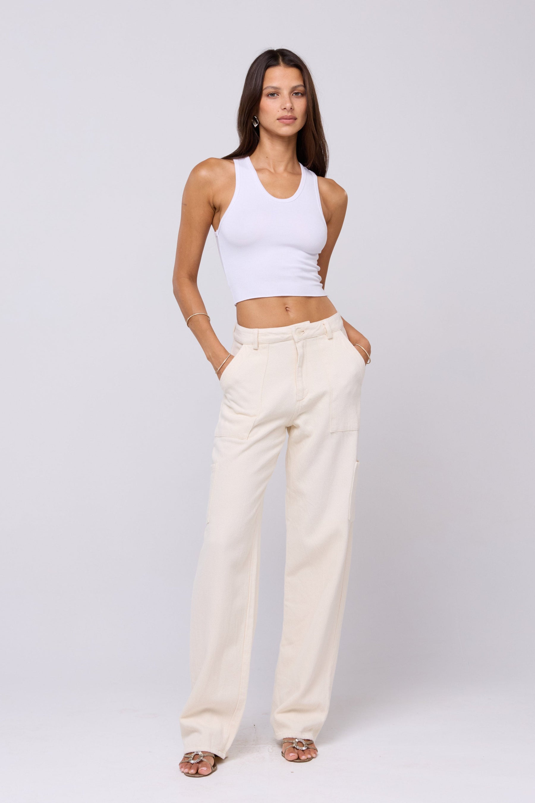 This is an image of Elsa Cargo Pant in Cream - RESA featuring a model wearing the dress