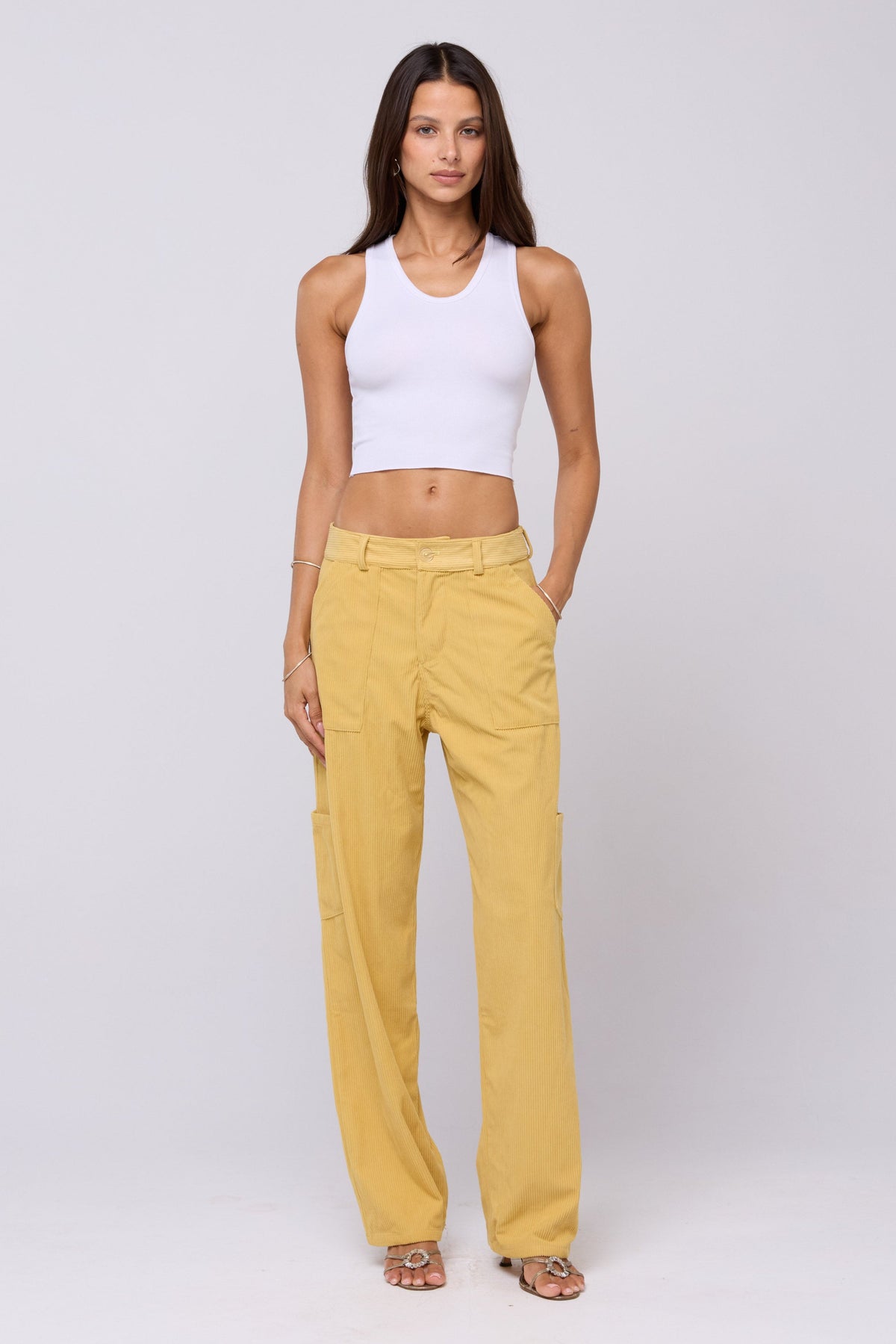 This is an image of Elsa Cargo Pant in Mustard - RESA featuring a model wearing the dress