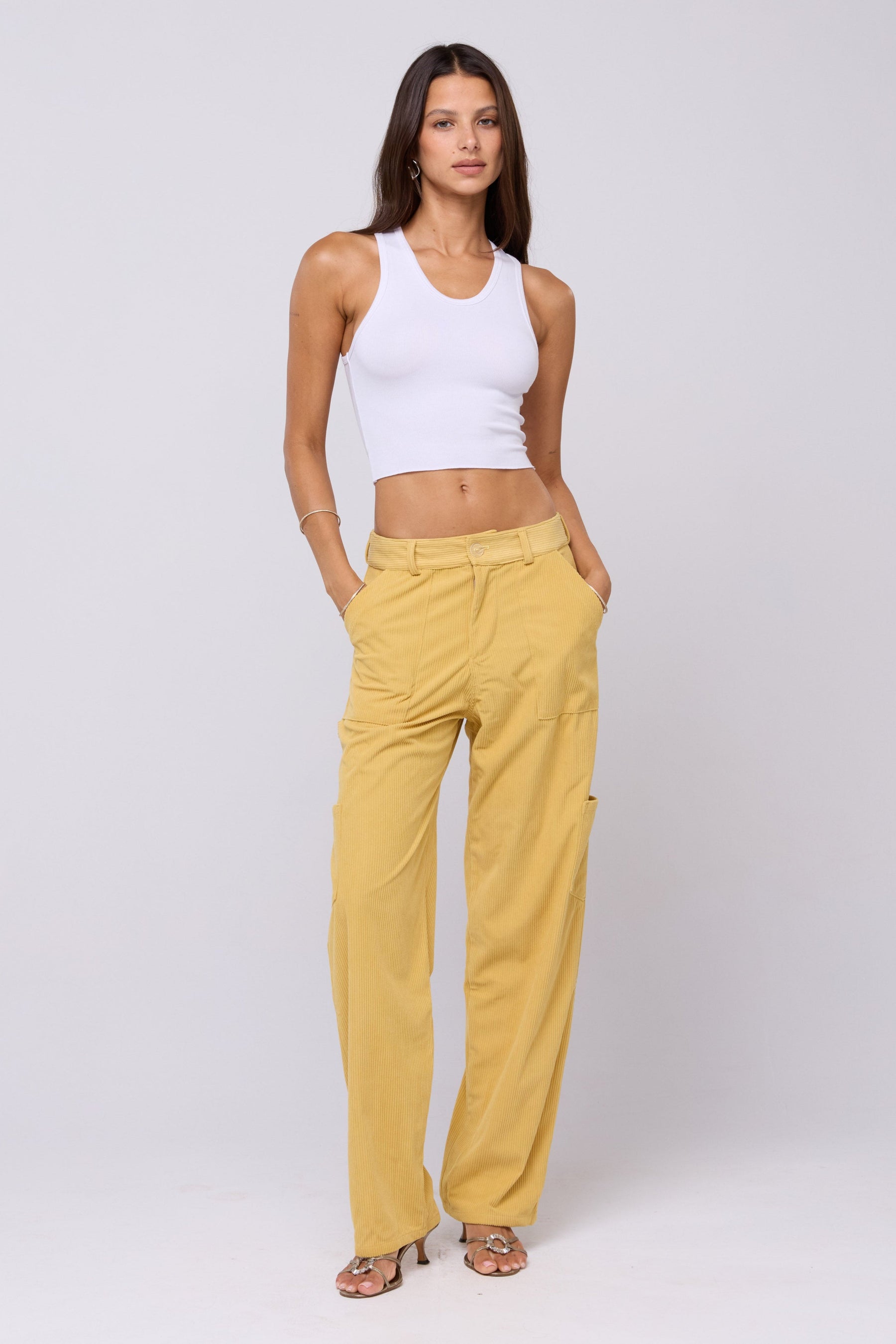 This is an image of Elsa Cargo Pant in Mustard - RESA featuring a model wearing the dress