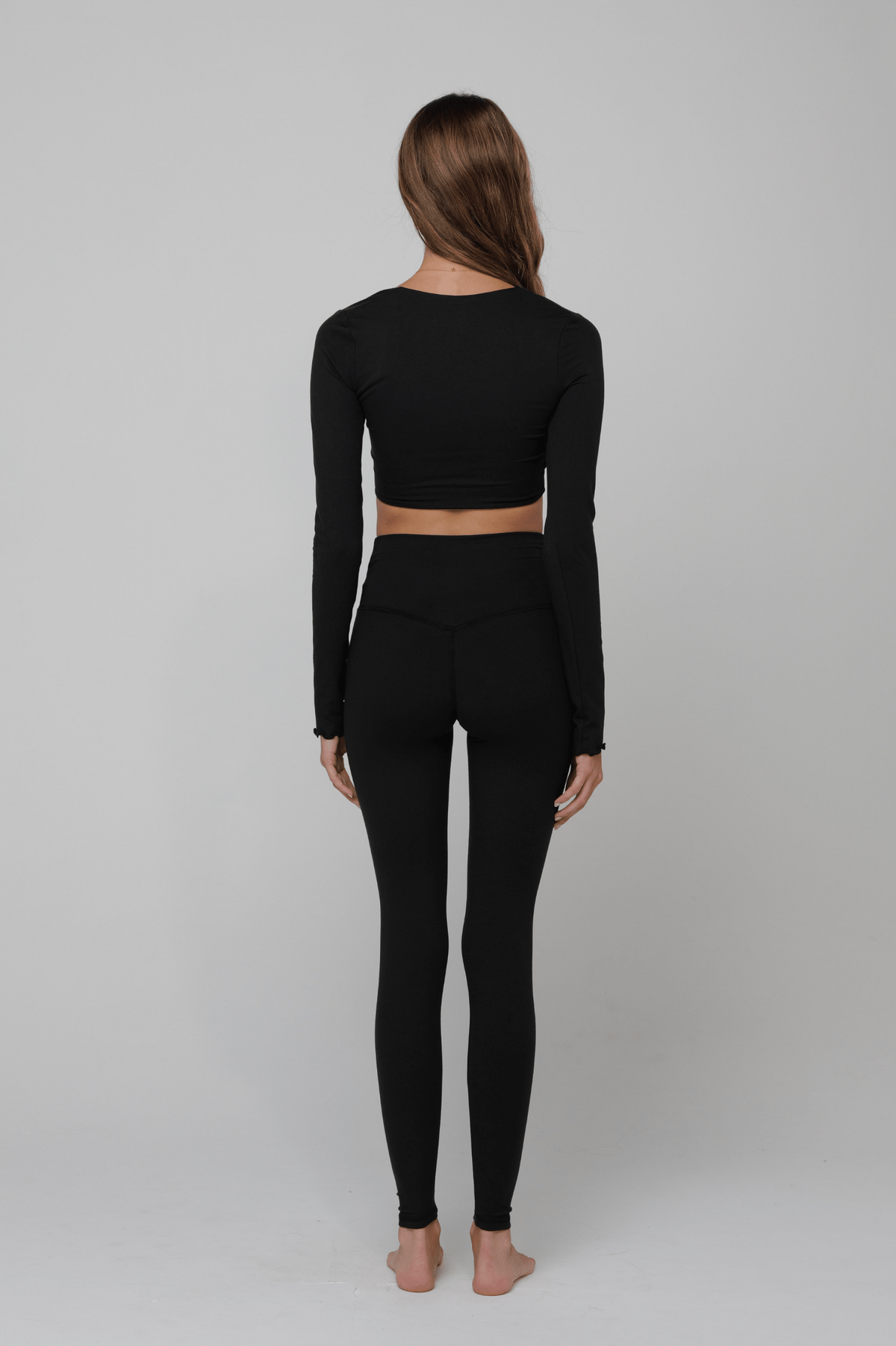 This is an image of Emily Top in Black - RESA featuring a model wearing the dress