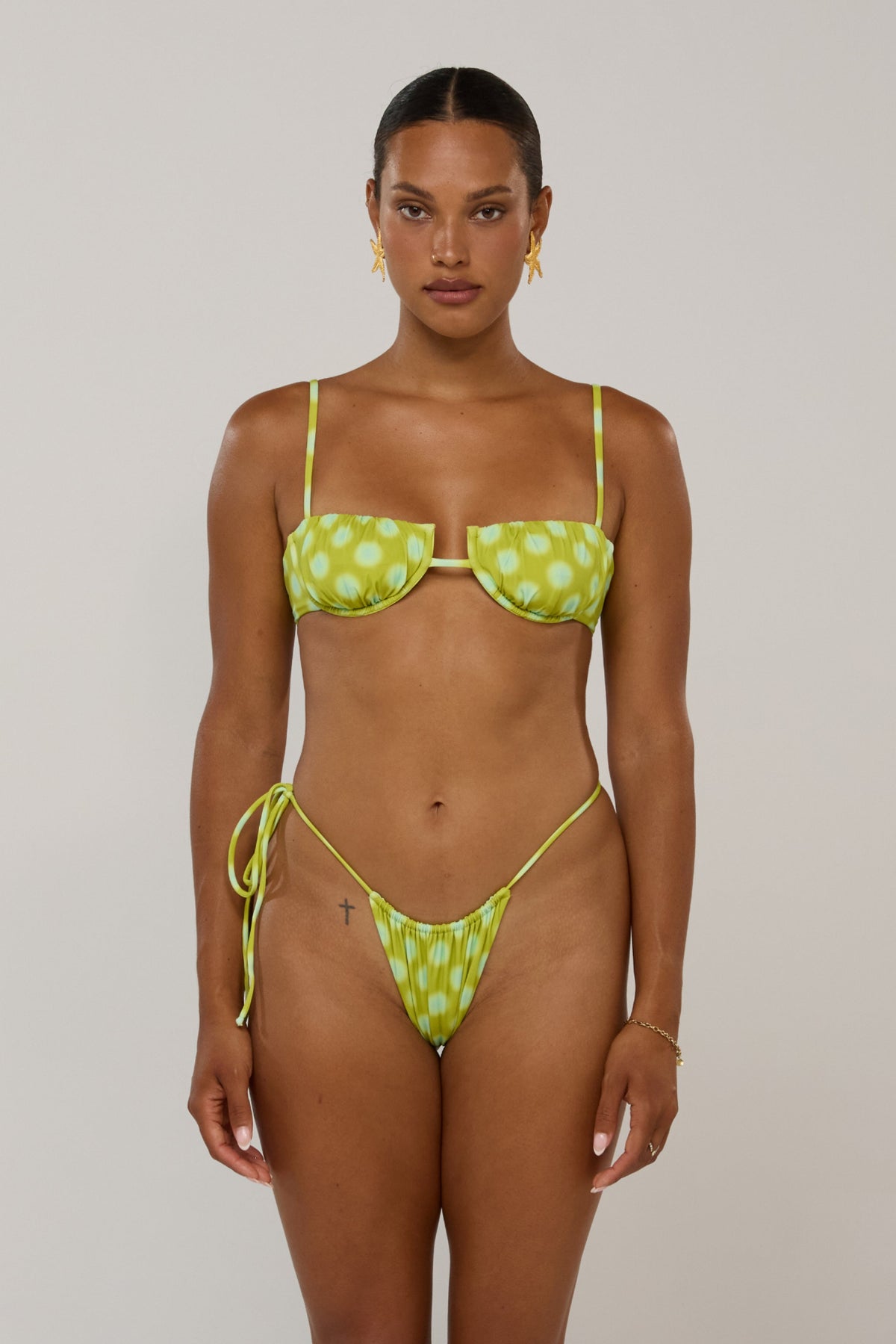 This is an image of Ernie in Luma - RESA featuring a model wearing the dress