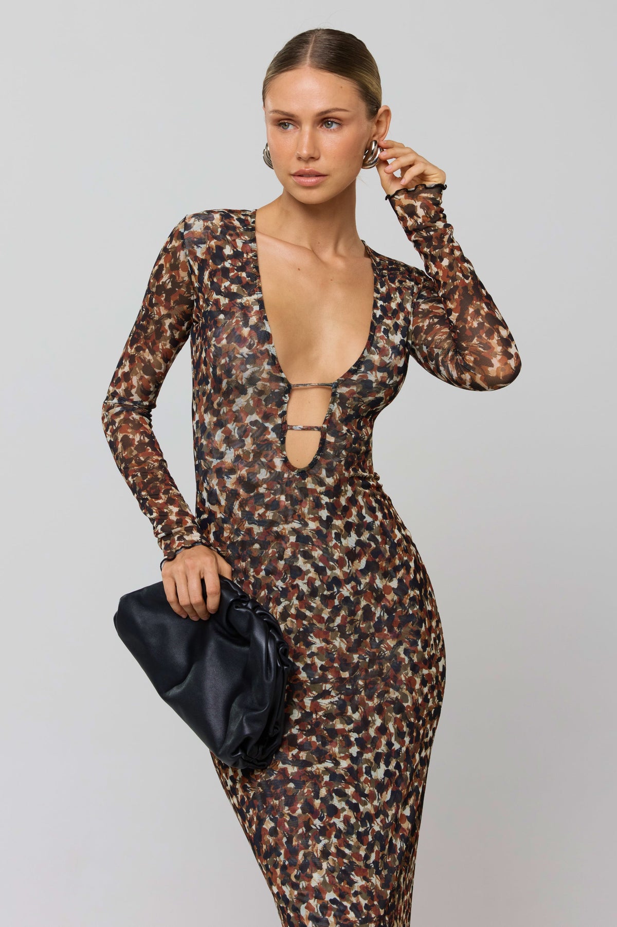 This is an image of Esme Dress in Terra - RESA featuring a model wearing the dress