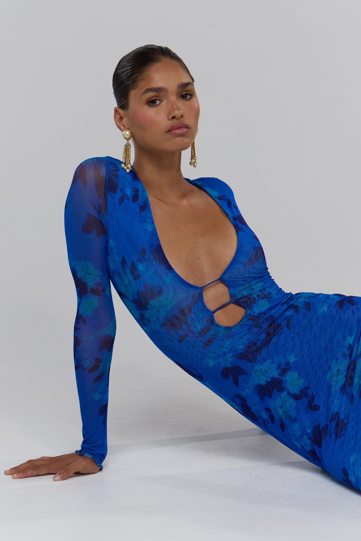 This is an image of Esme in Azul - RESA featuring a model wearing the dress