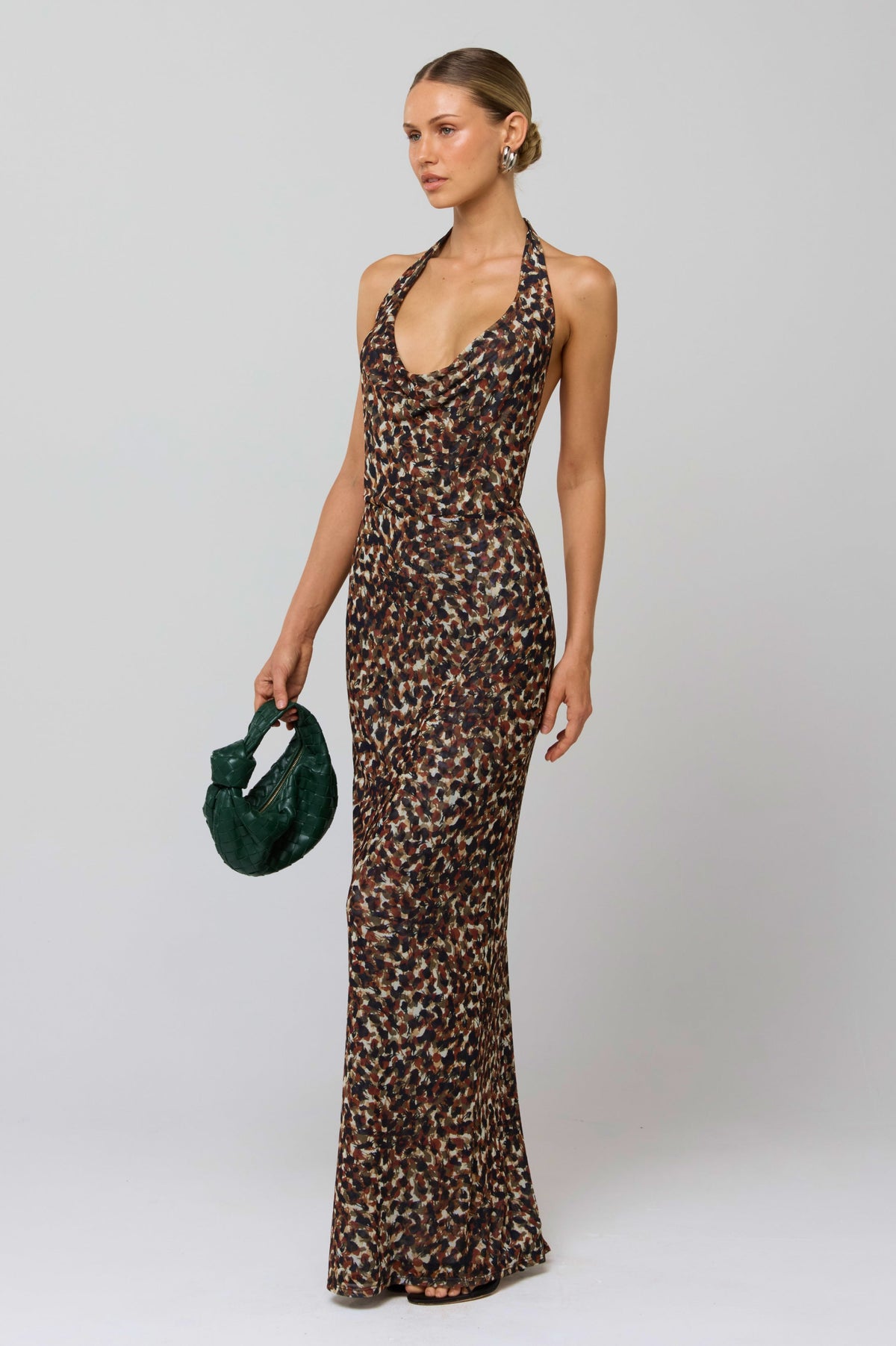 This is an image of Fiona Dress in Terra - RESA featuring a model wearing the dress