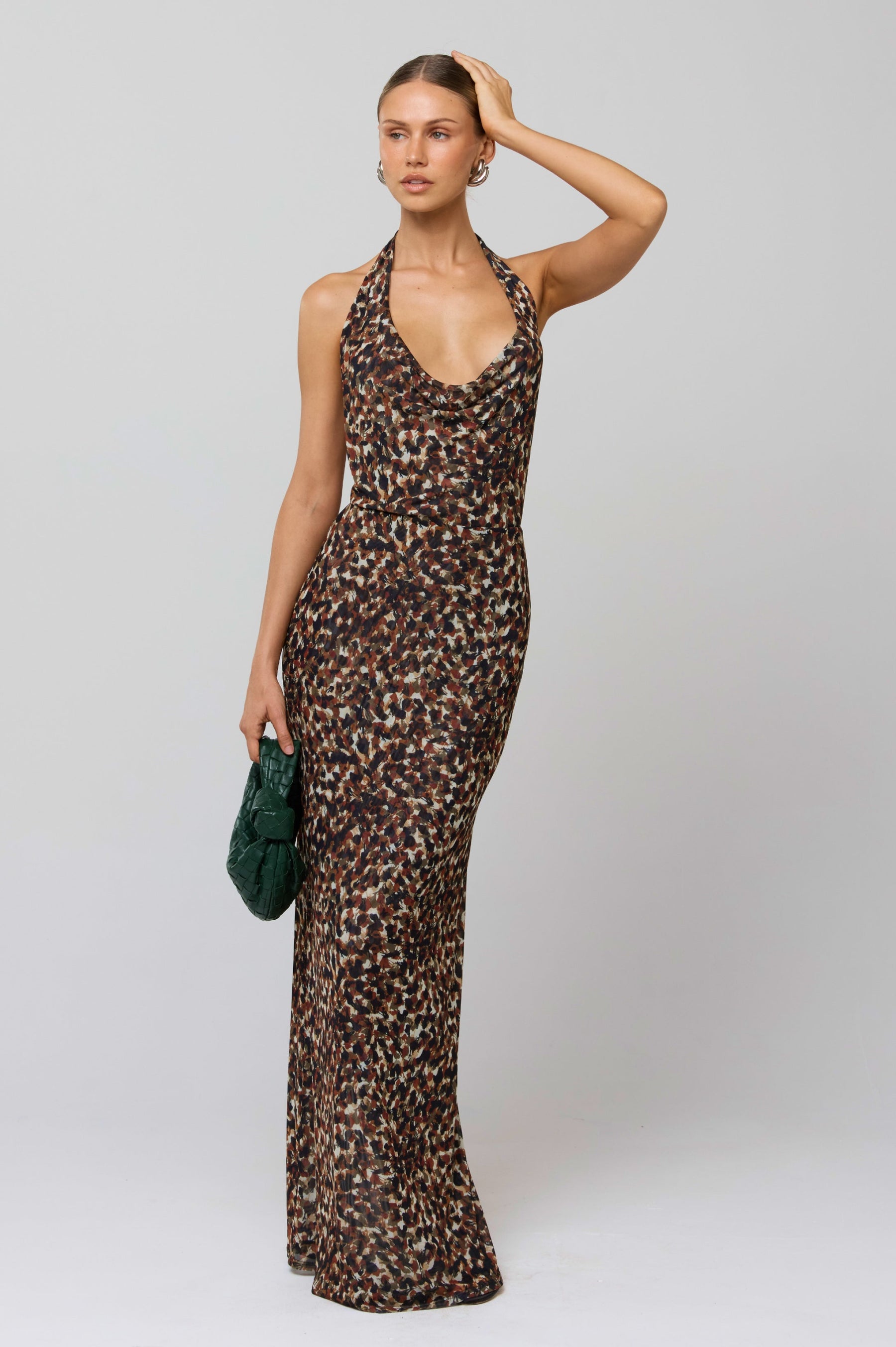 This is an image of Fiona Dress in Terra - RESA featuring a model wearing the dress