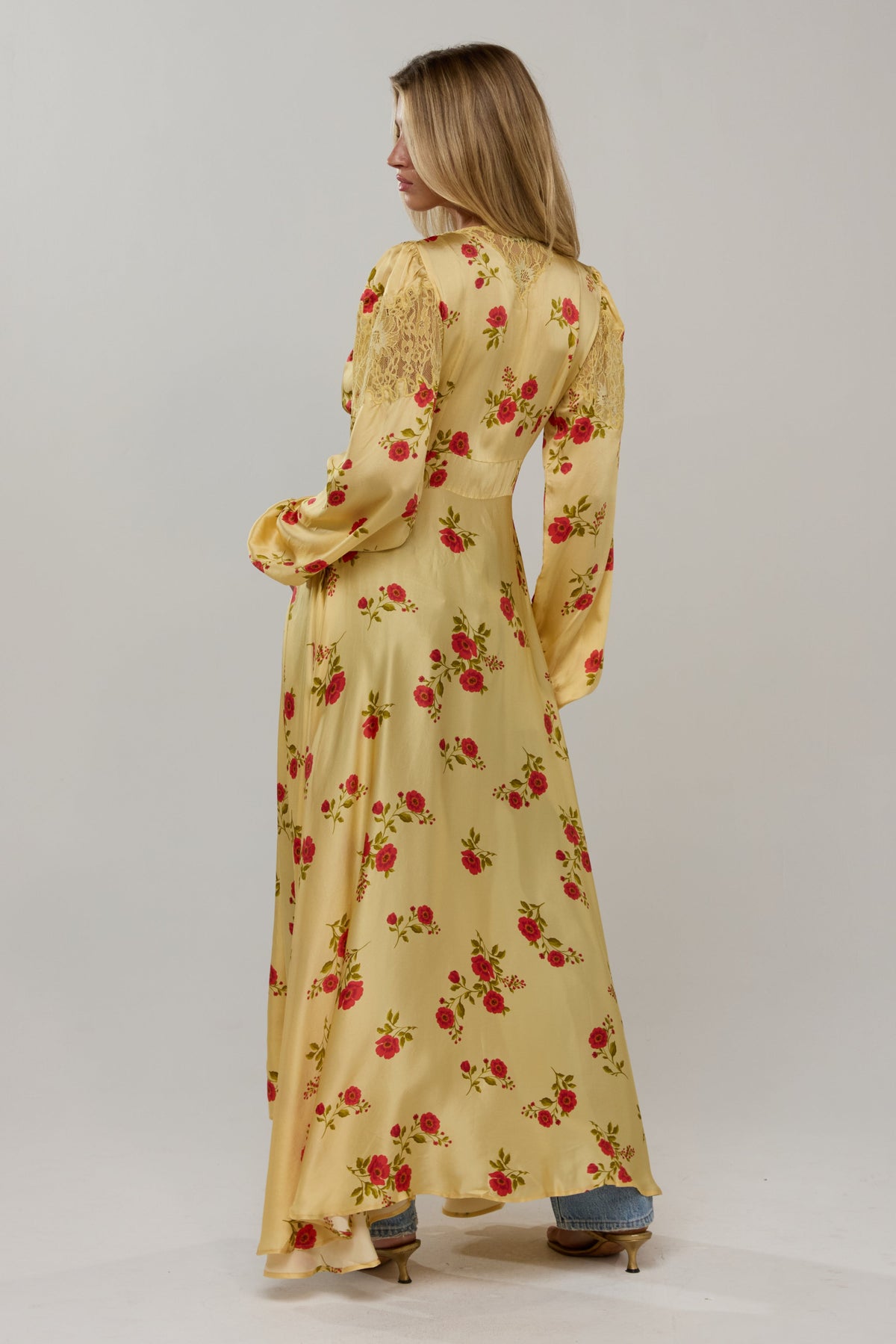 This is an image of Florence in Saffron - RESA featuring a model wearing the dress