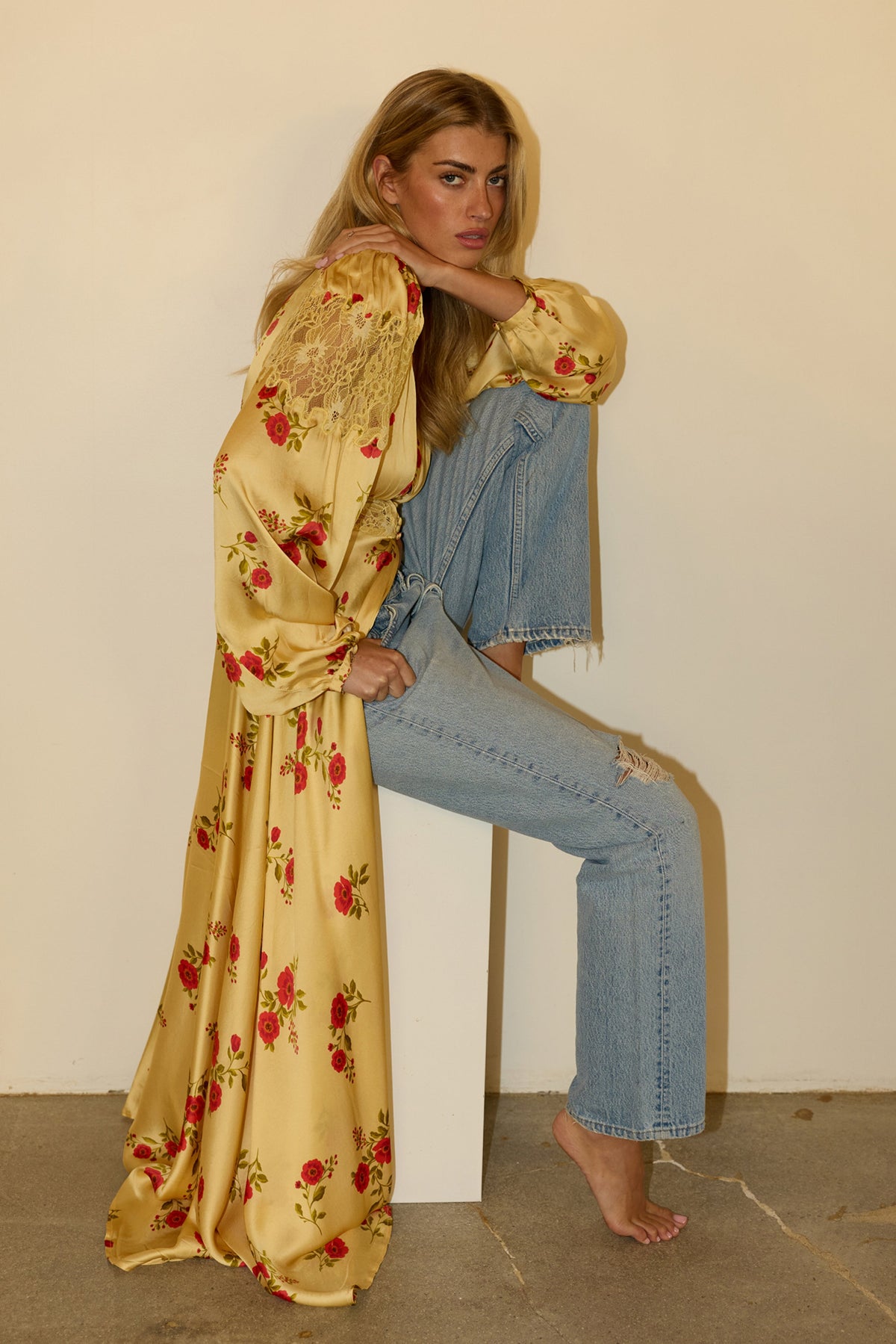This is an image of Florence in Saffron - RESA featuring a model wearing the dress