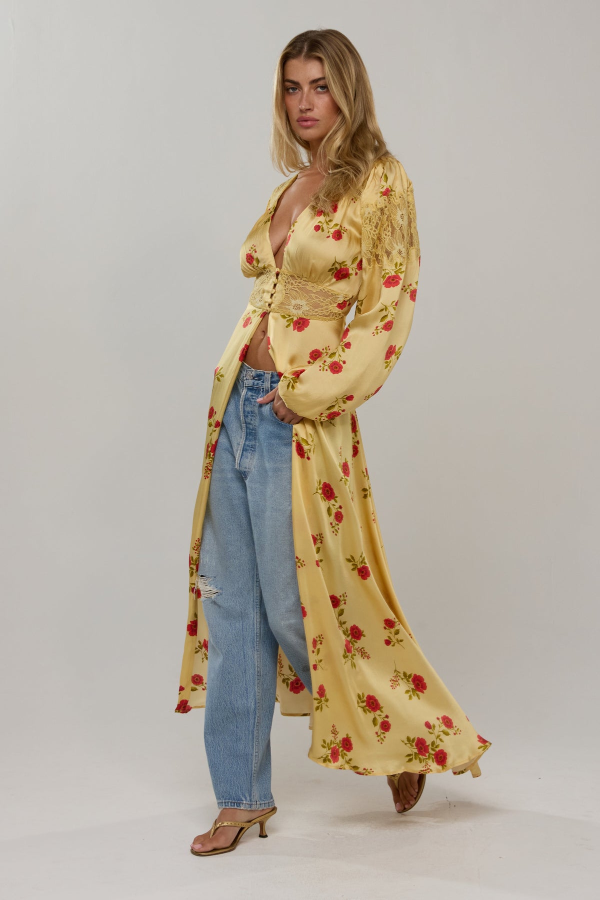 This is an image of Florence in Saffron - RESA featuring a model wearing the dress