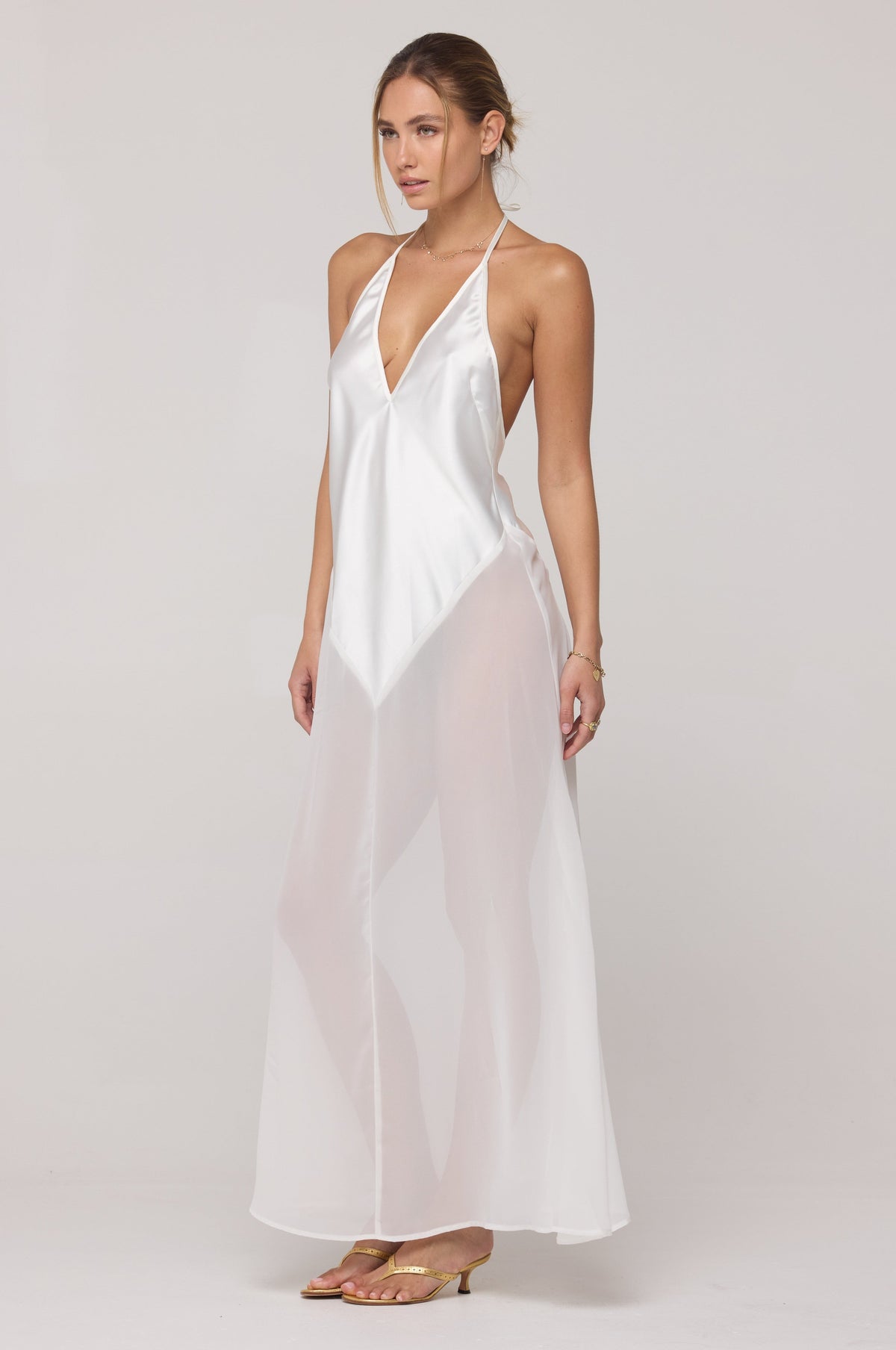 This is an image of Goddess Maxi Dress in White - RESA featuring a model wearing the dress