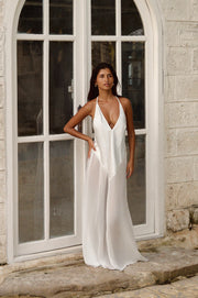 This is an image of Goddess Maxi Dress in White - RESA featuring a model wearing the dress