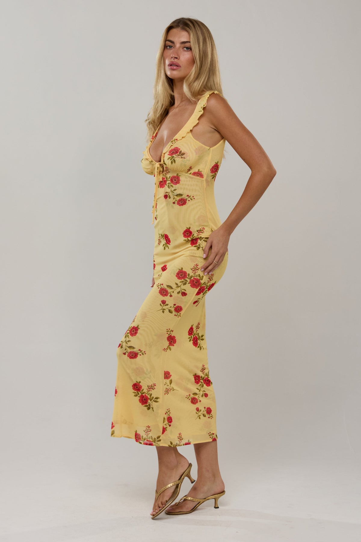 This is an image of Goldie in Saffron - RESA featuring a model wearing the dress