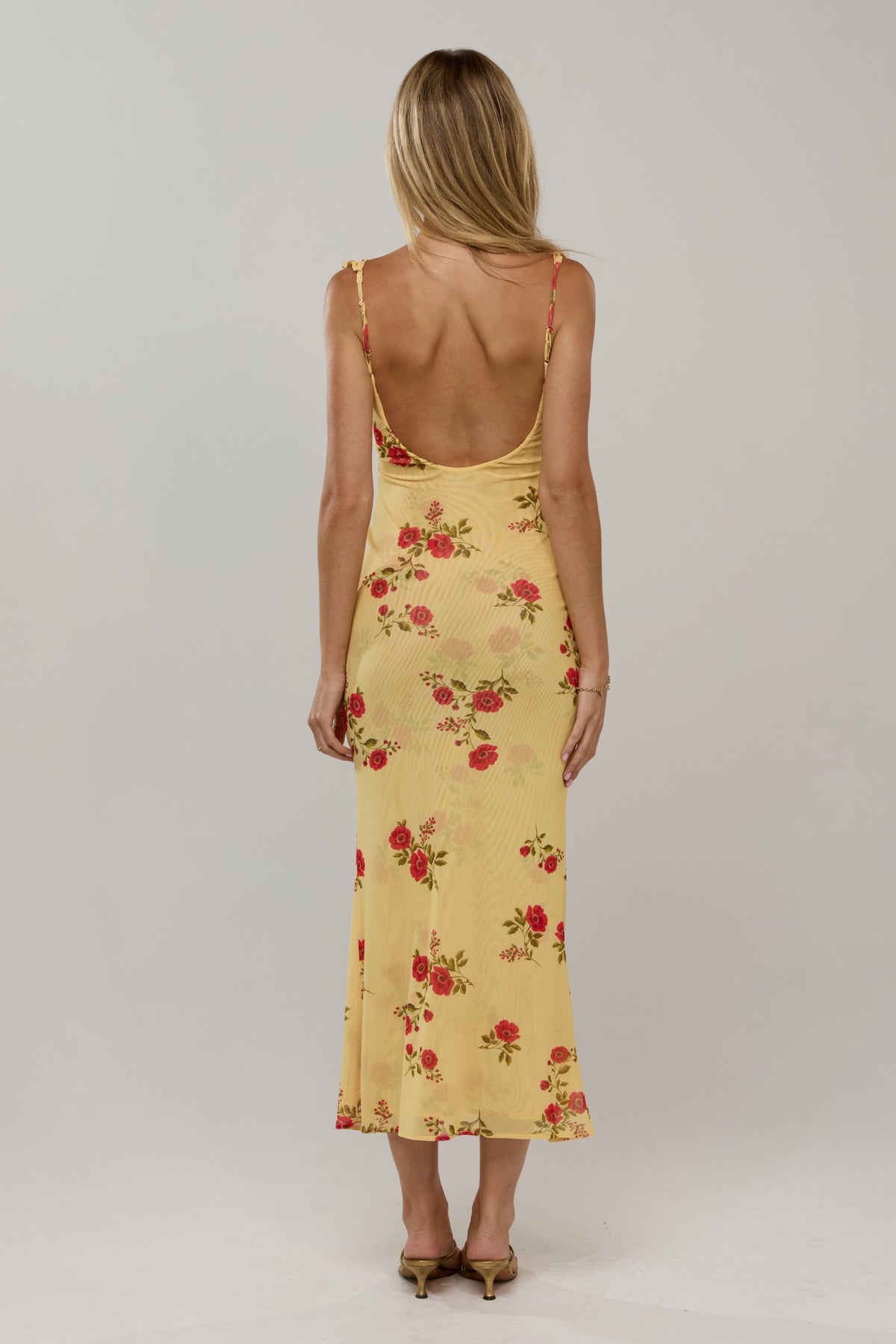 This is an image of Goldie in Saffron - RESA featuring a model wearing the dress