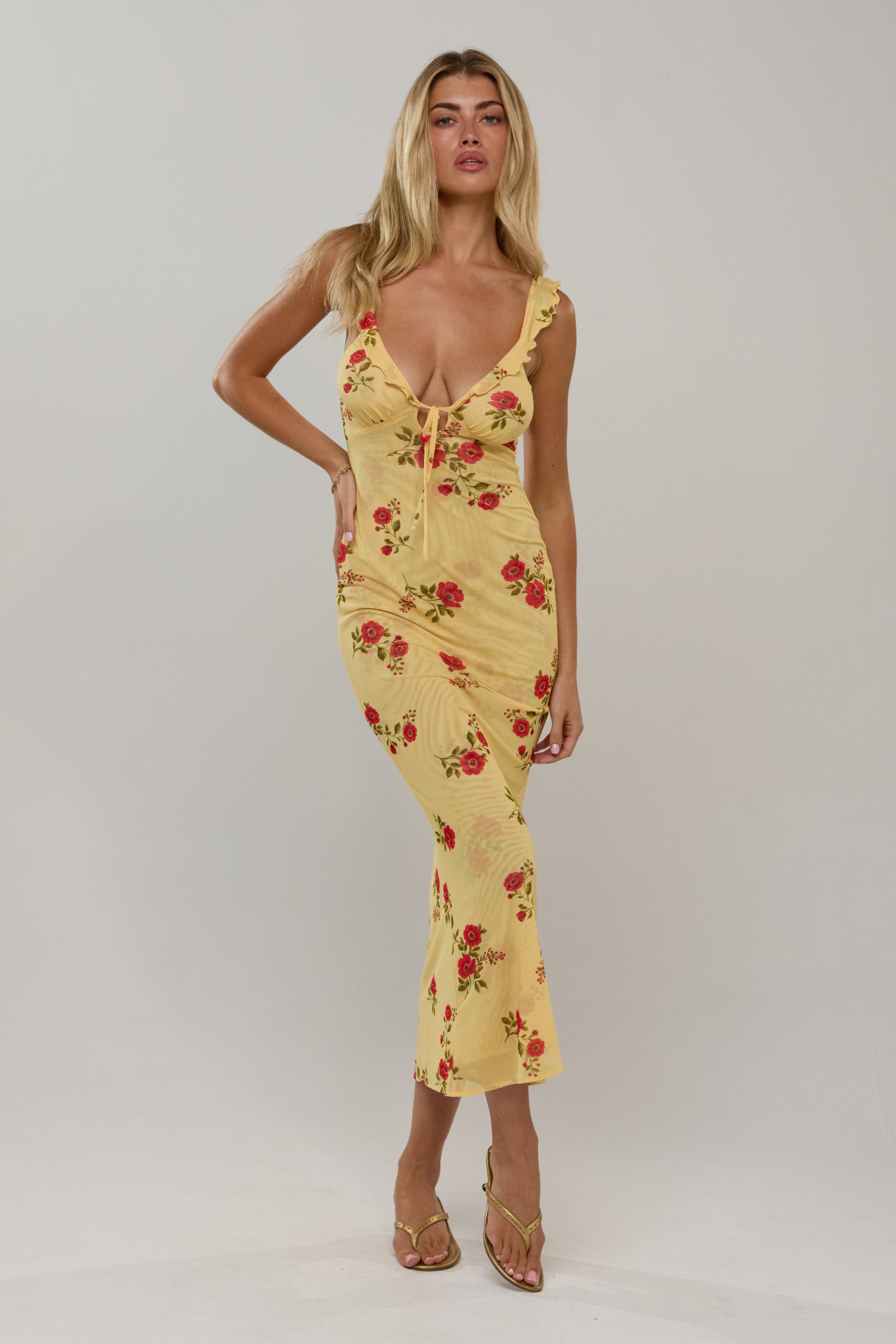 This is an image of Goldie in Saffron - RESA featuring a model wearing the dress