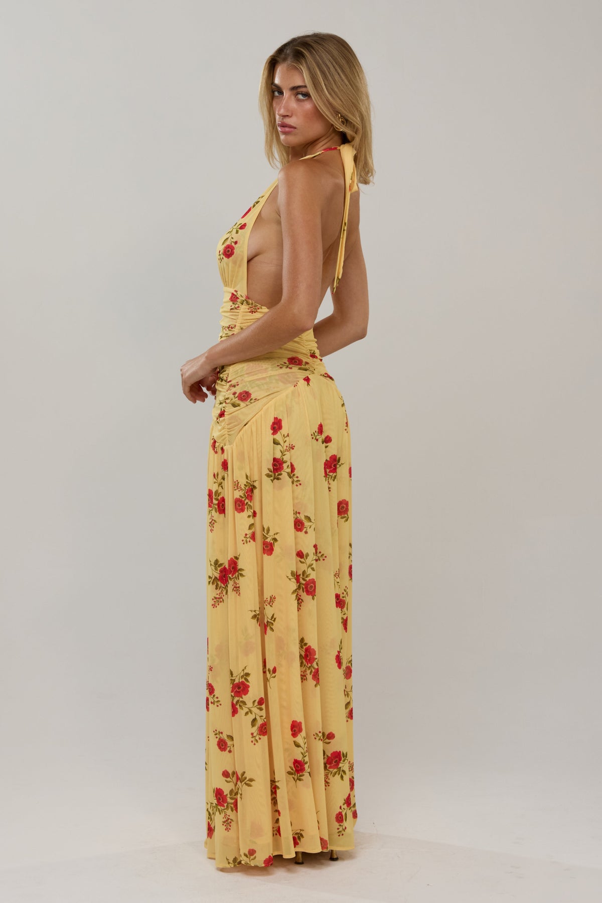 This is an image of Grace in Saffron - RESA featuring a model wearing the dress