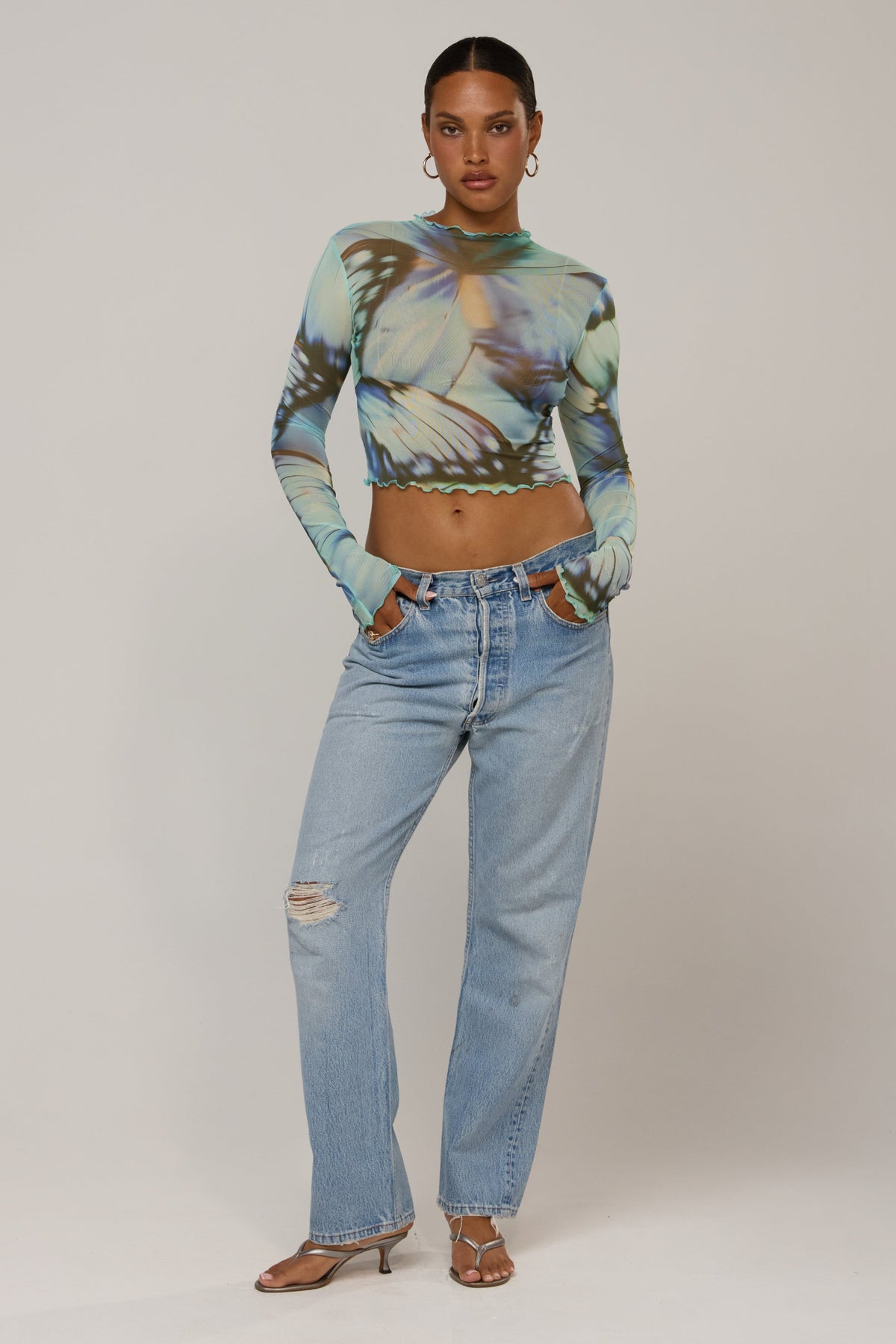 This is an image of Ida in Mariposa - RESA featuring a model wearing the dress